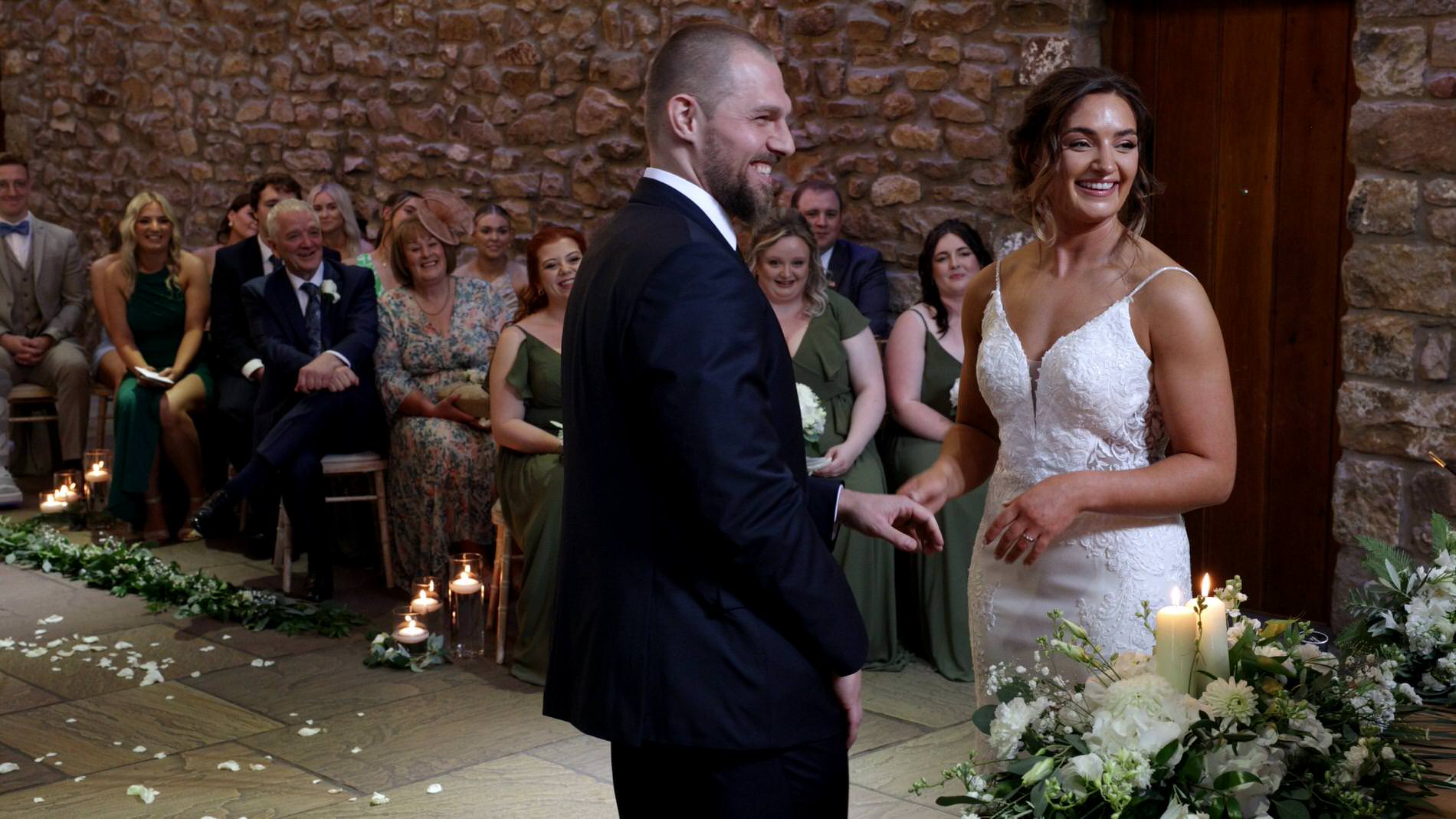 a video still of a couple laughing during their Browsholme Hall wedding ceremony