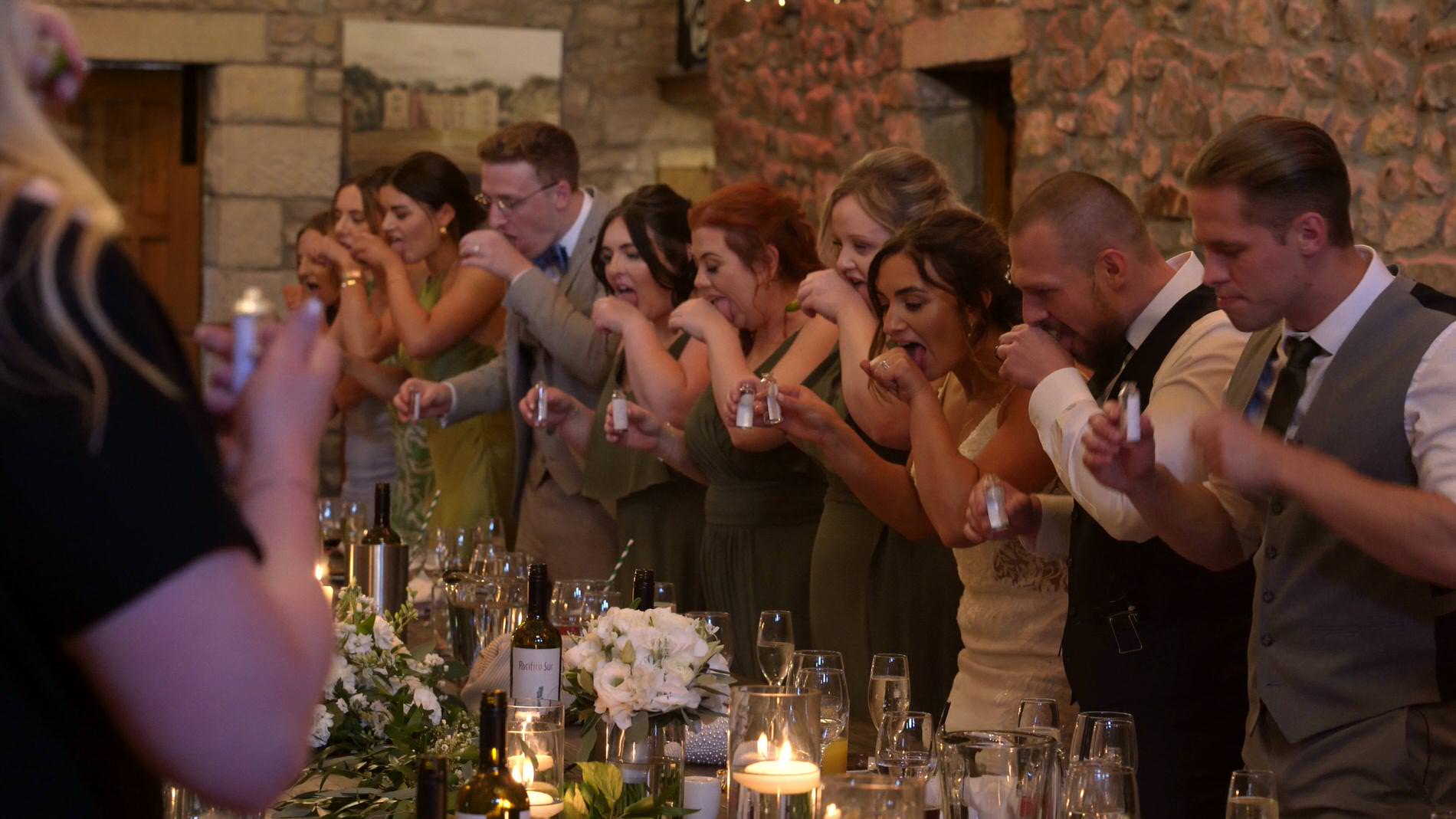 Annabelle and Dean Browsholme Hall Wedding Video 24 the wedding guests do shots at the wedding reception at Browsholme Hall
