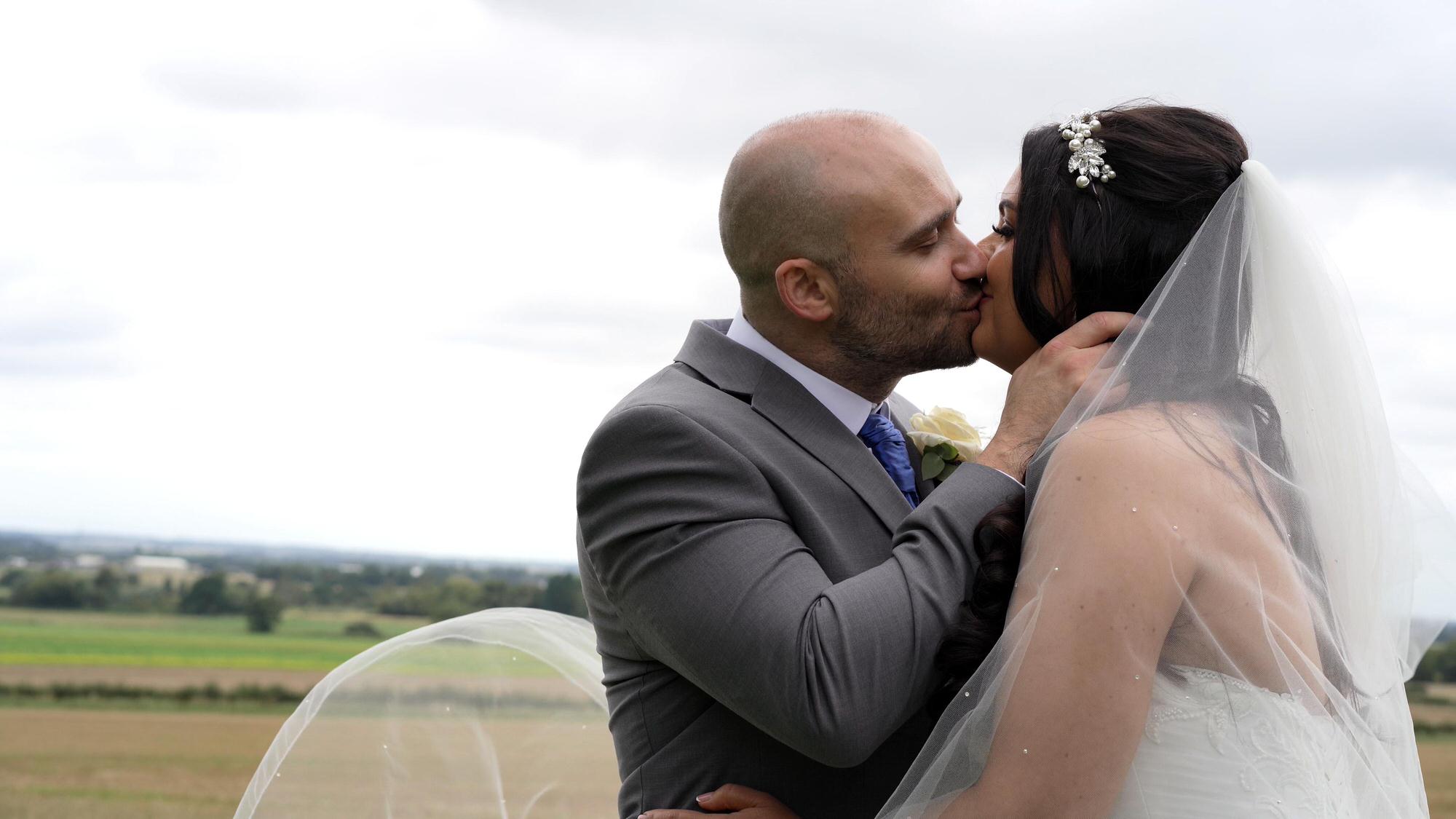 a video still of the couple kissing after a wedding at West Tower Ormskirk