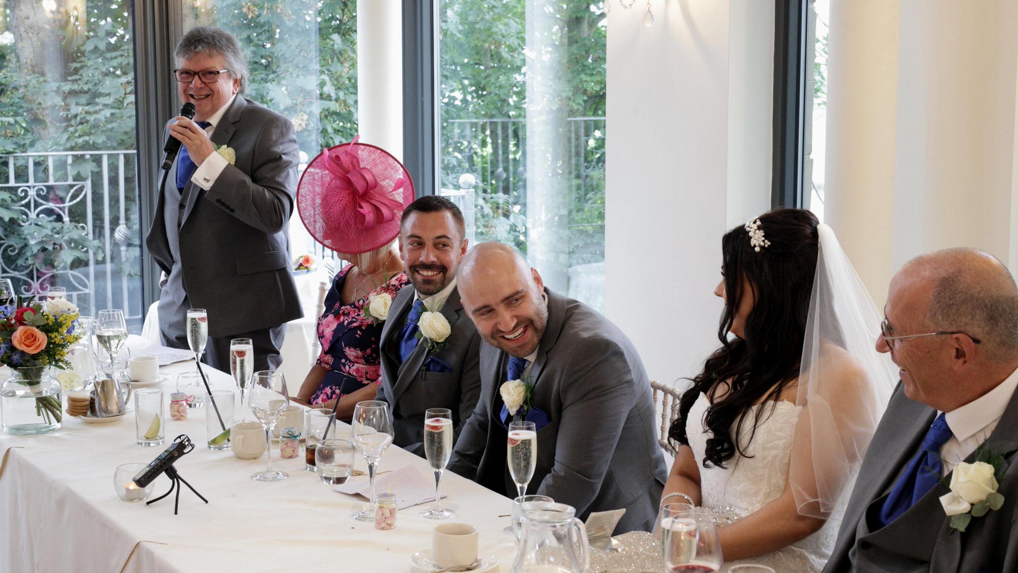 the top table laugh during the father of the bride speech
