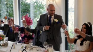 the groom toasts the bride during his speech