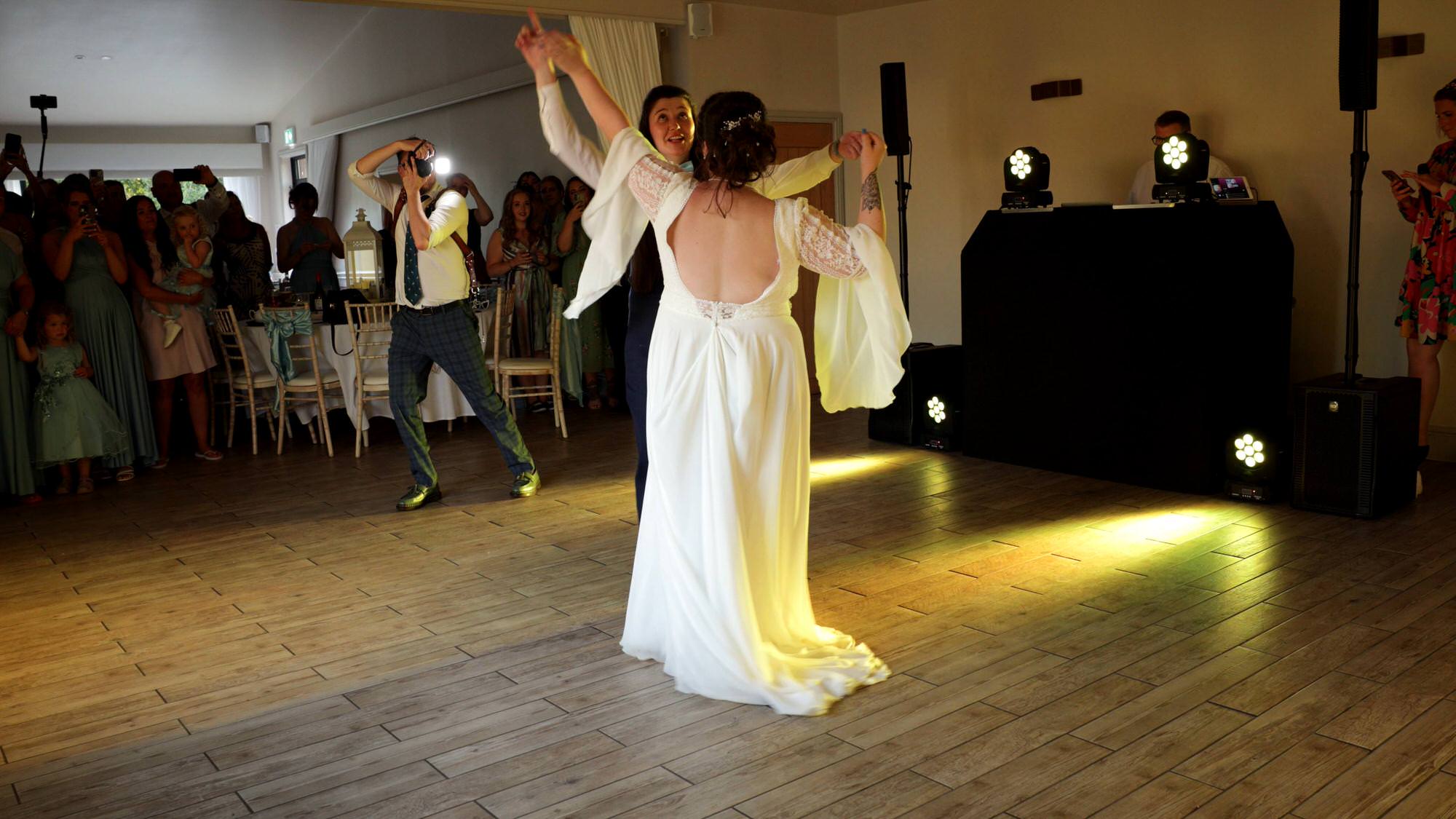 two brides dance for their first dance at The Aviary in Ormskirk