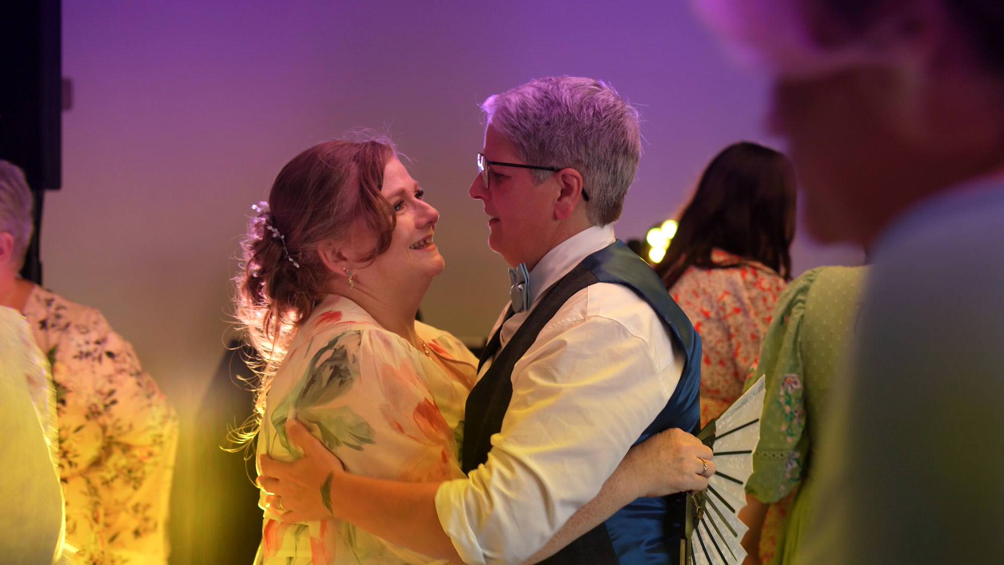 videographer captures a candid moment of two guests dancing at The Aviary in Ormskirk