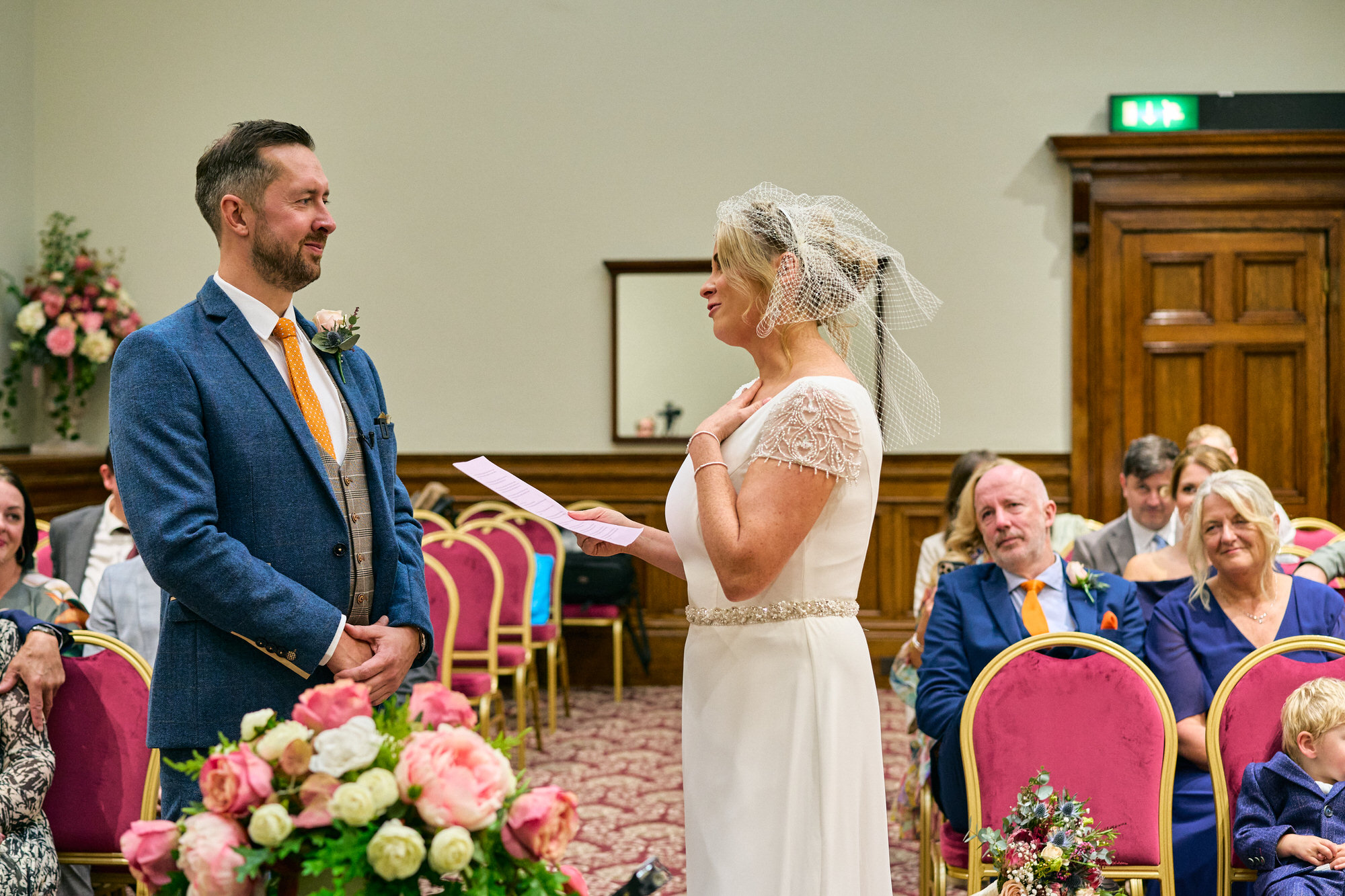 the bride reads her personal vows during a wedding ceremony in liverpool