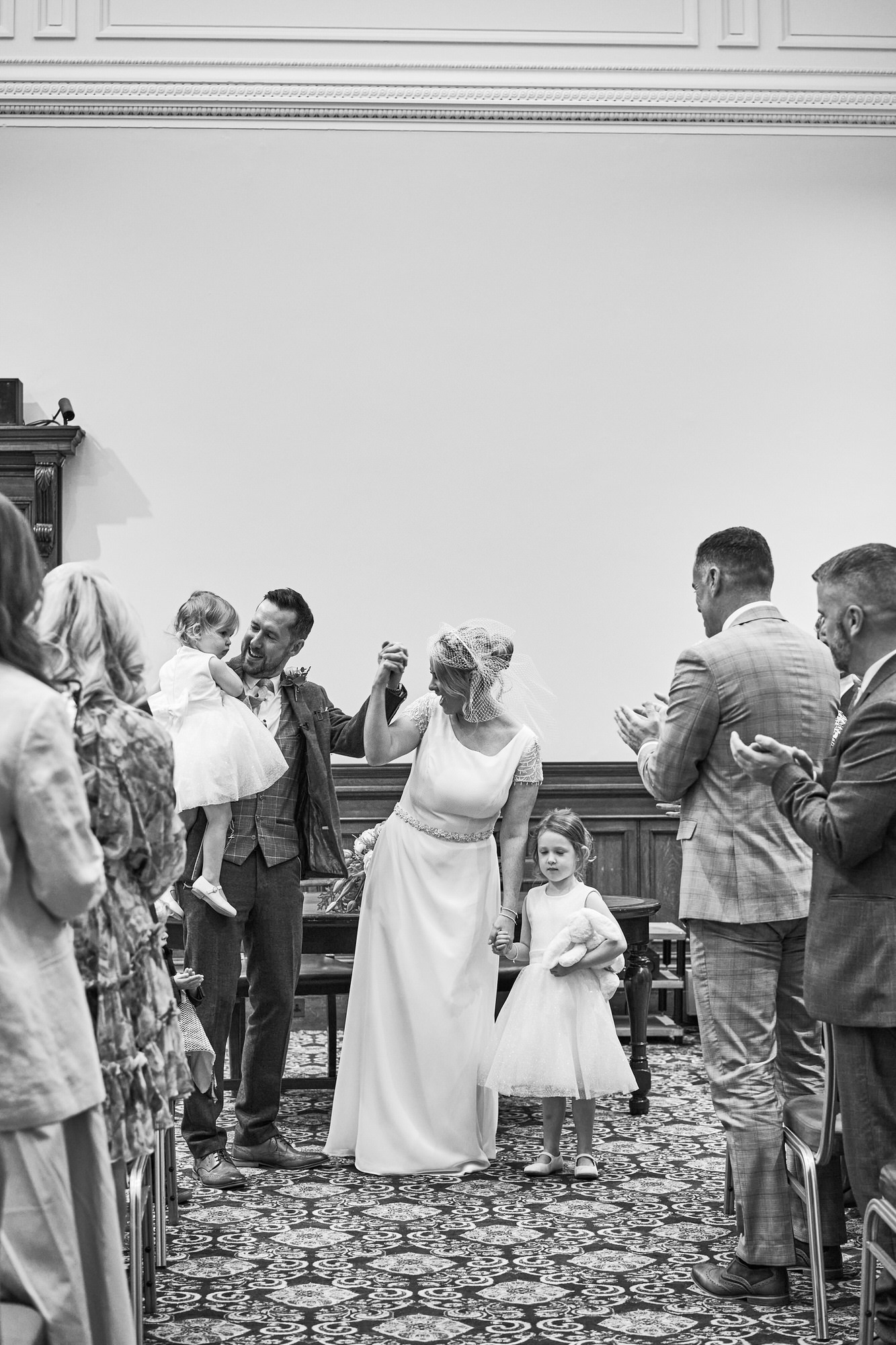 the couple cheer with their children as they're now married!