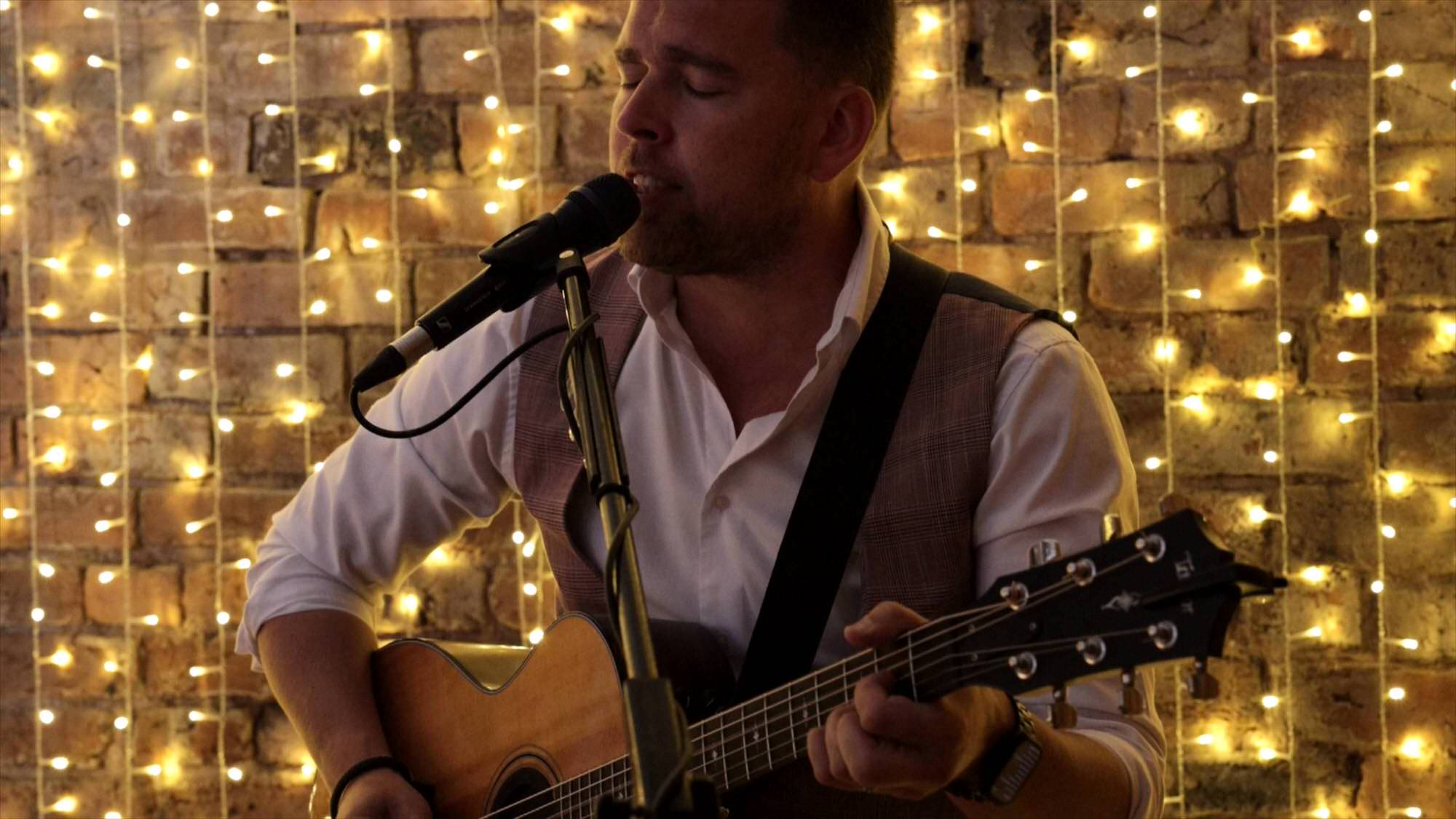 alex birtwell sings an acoustic set for a couple at the barn at morleys hall