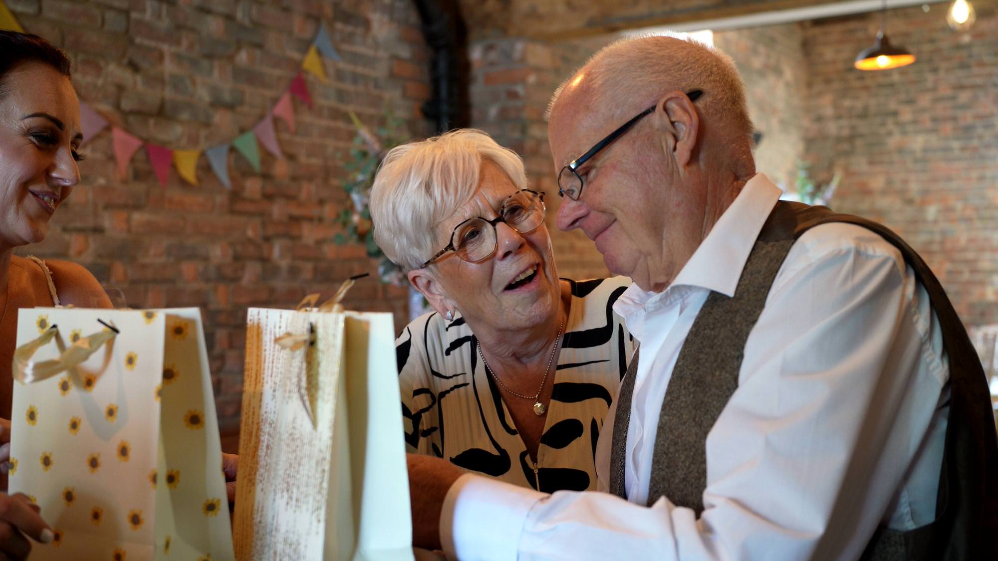 Katie and Paul Barn at Morleys Hall Wedding 21 video still of grandparents getting emotional opening gifts
