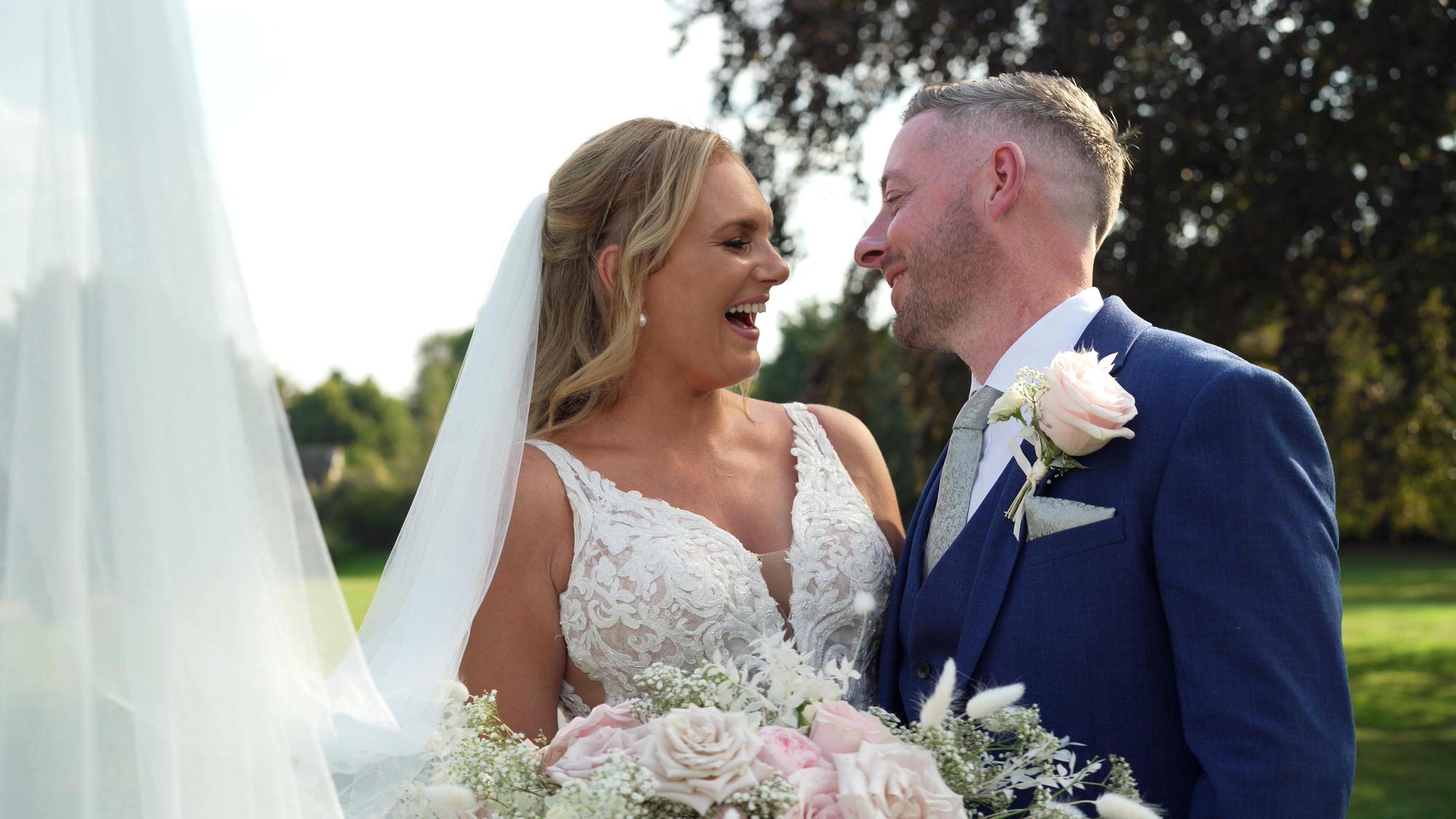 a natural moment of the couple laughing during their Stubton Hall wedding reception