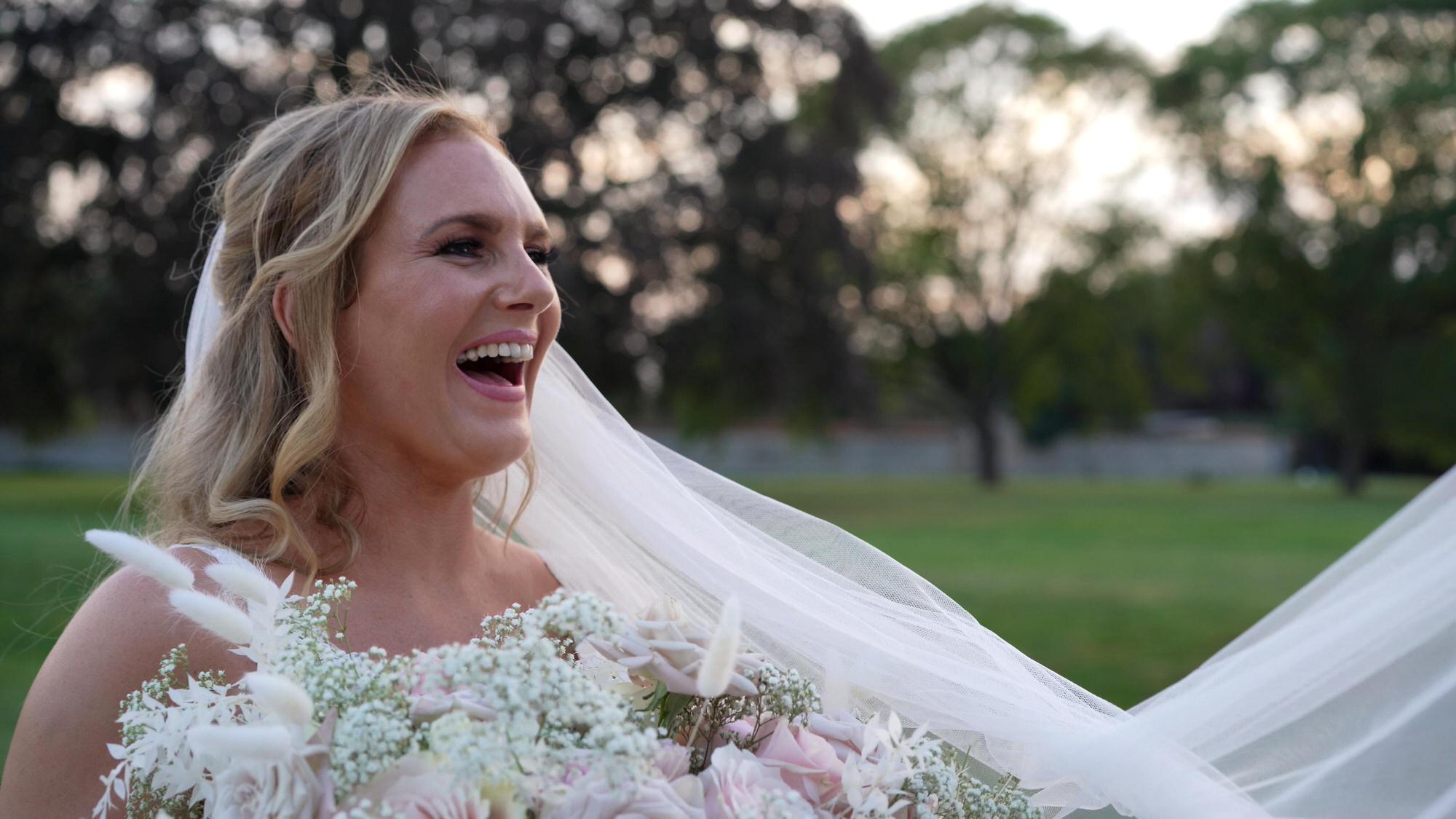 a bride laughs during golden hour in the gardens at Stubton Hall Newark