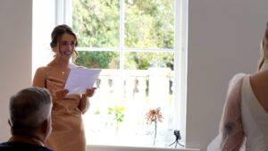 a bridesmaid gets emotional during the wedding ceremony reading