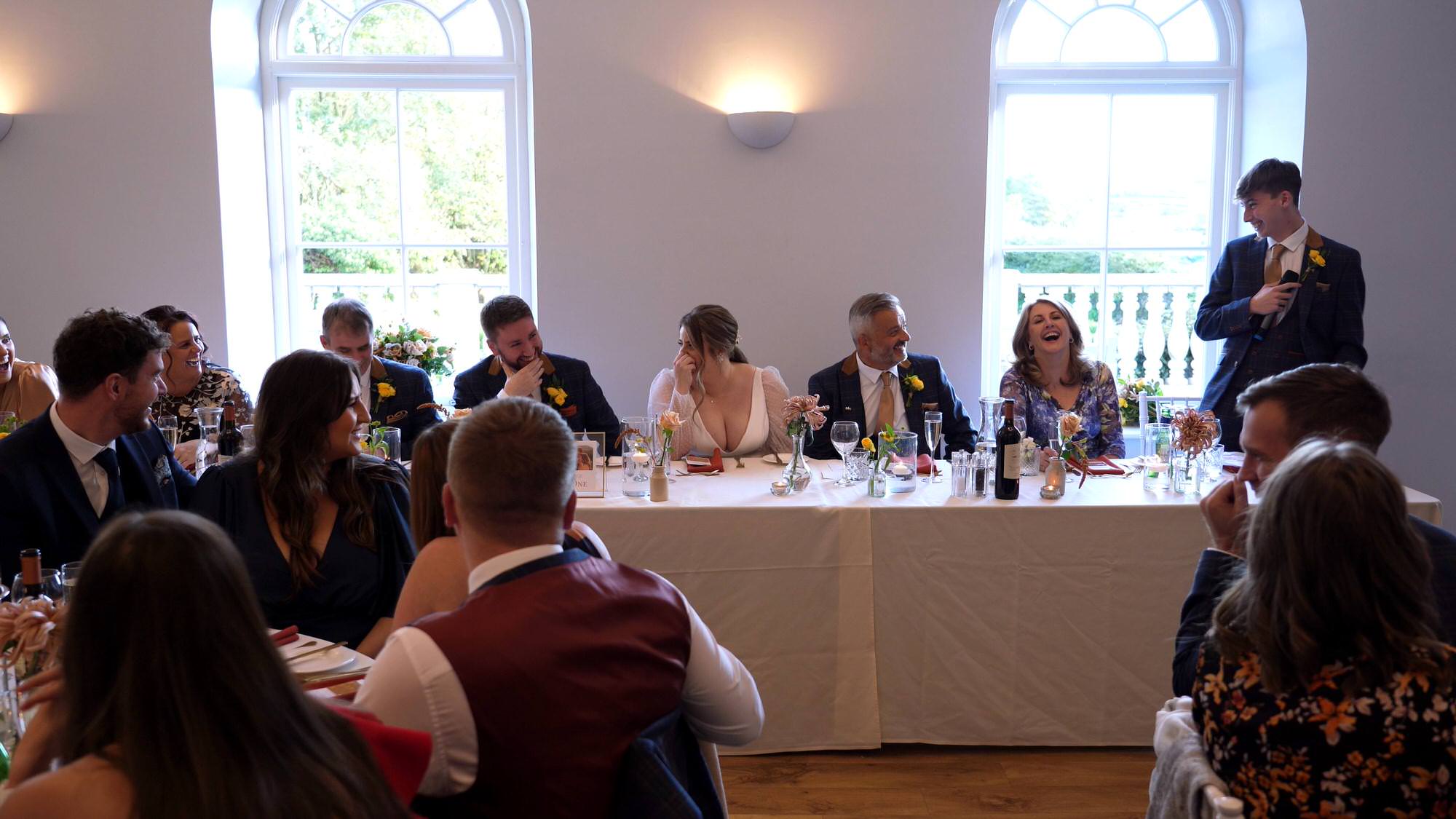 a video still of a top table during the speeches at a Cartmel Old Grammar wedding