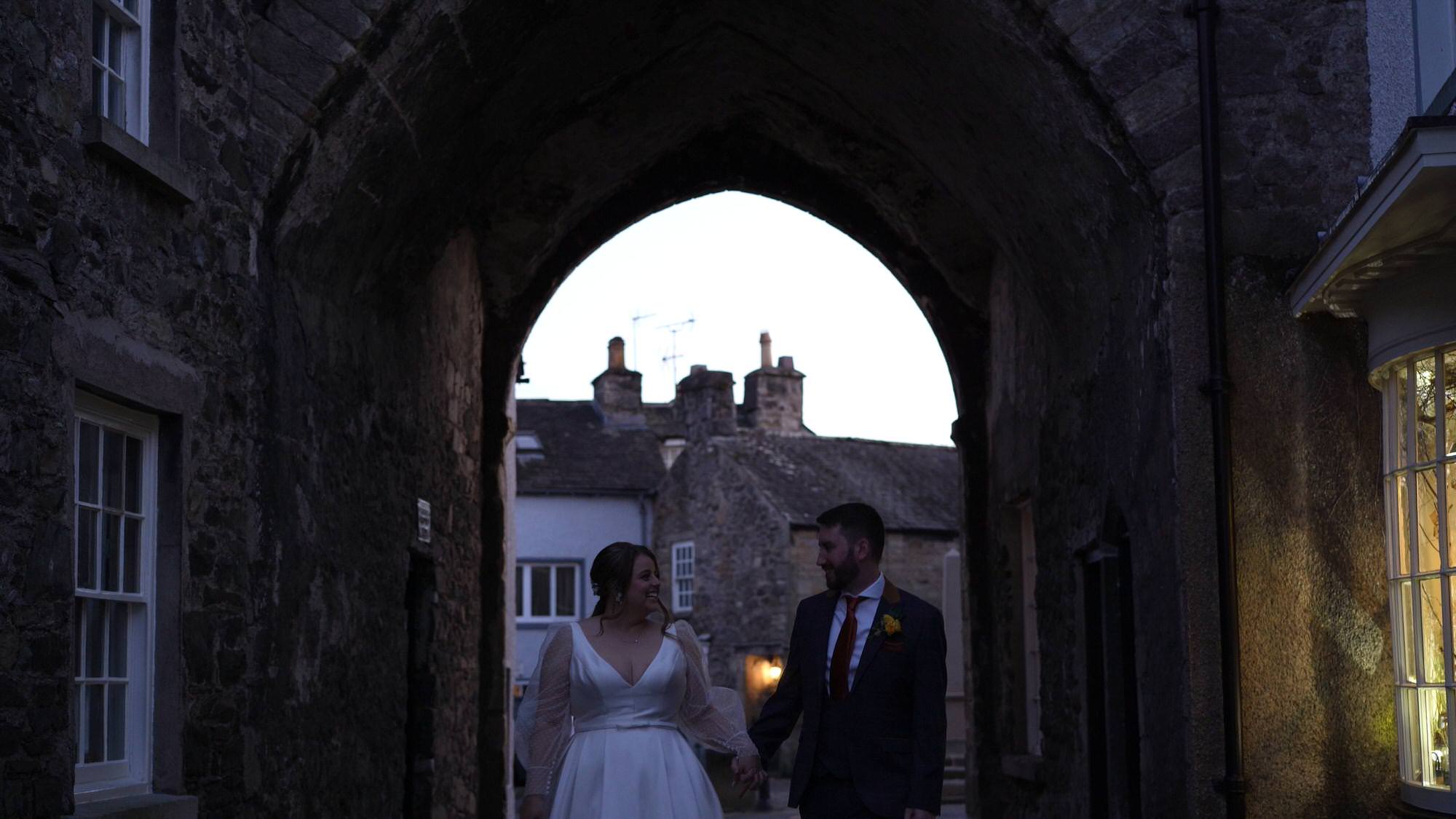 the couple take a walk with the videographer around Cartmel Village