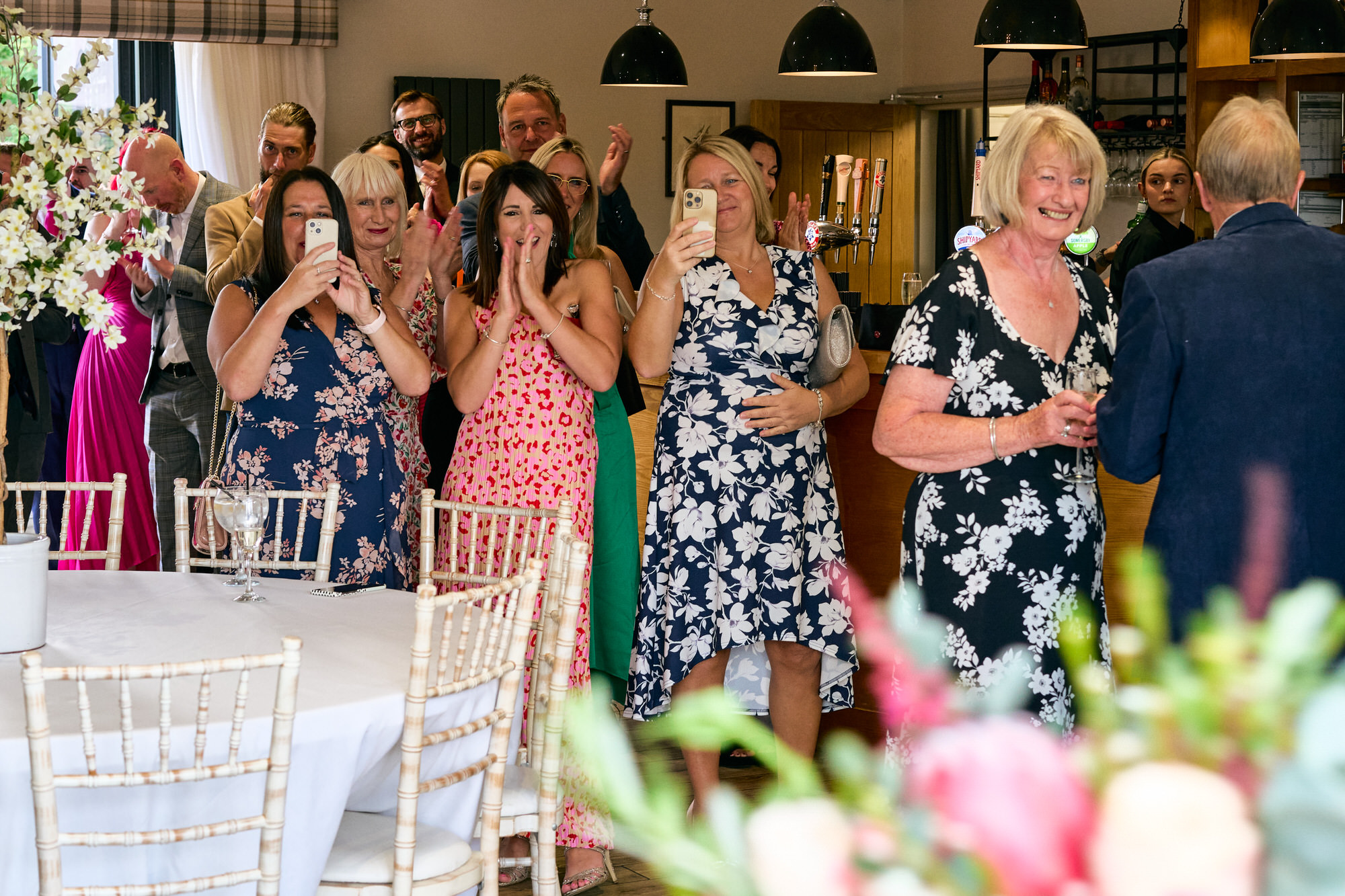 guests cheer as the couple are announced in to The Aviary Ormskirk