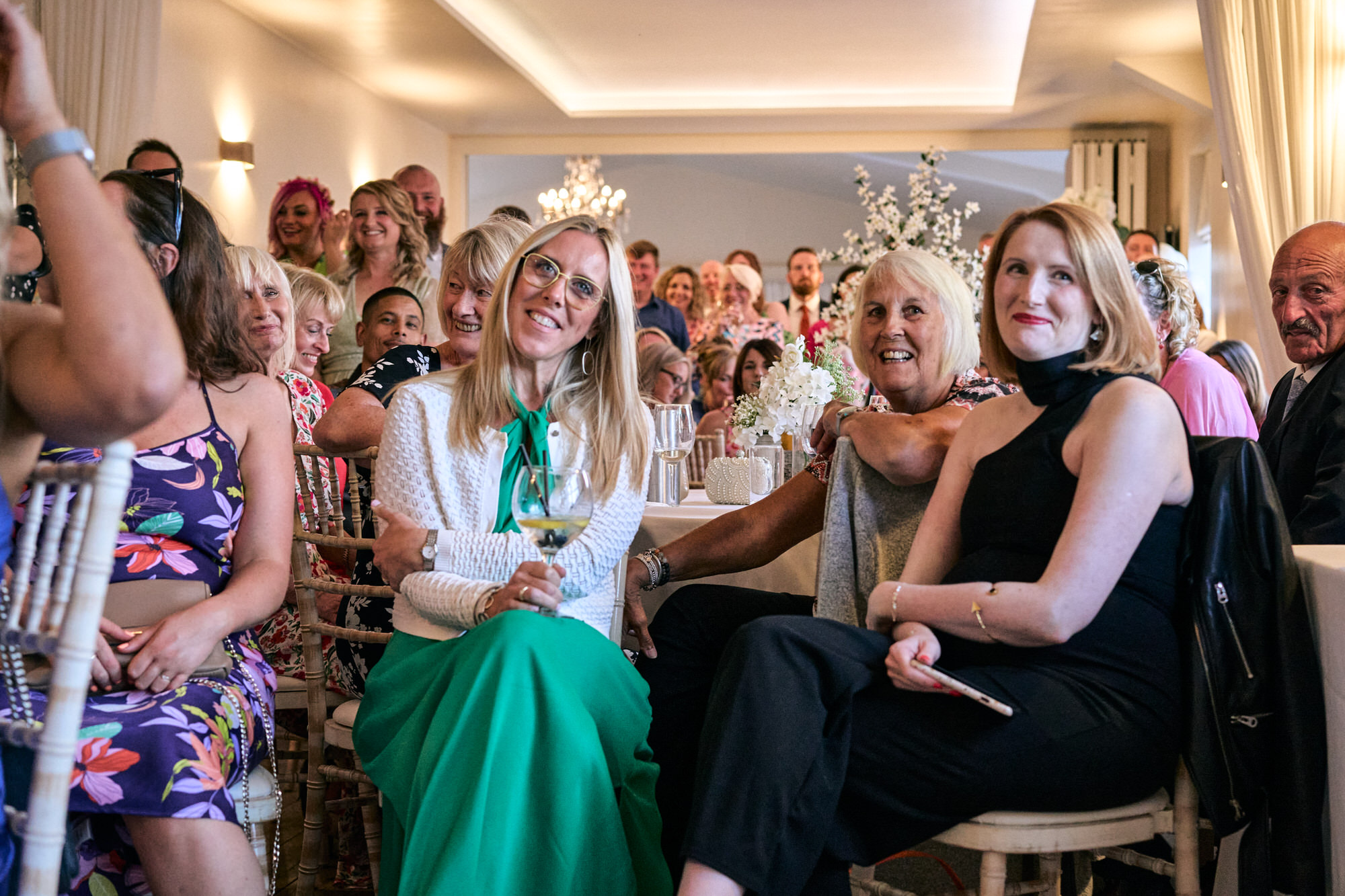 guests smile along with the wedding speeches at The Aviary Ormskirk