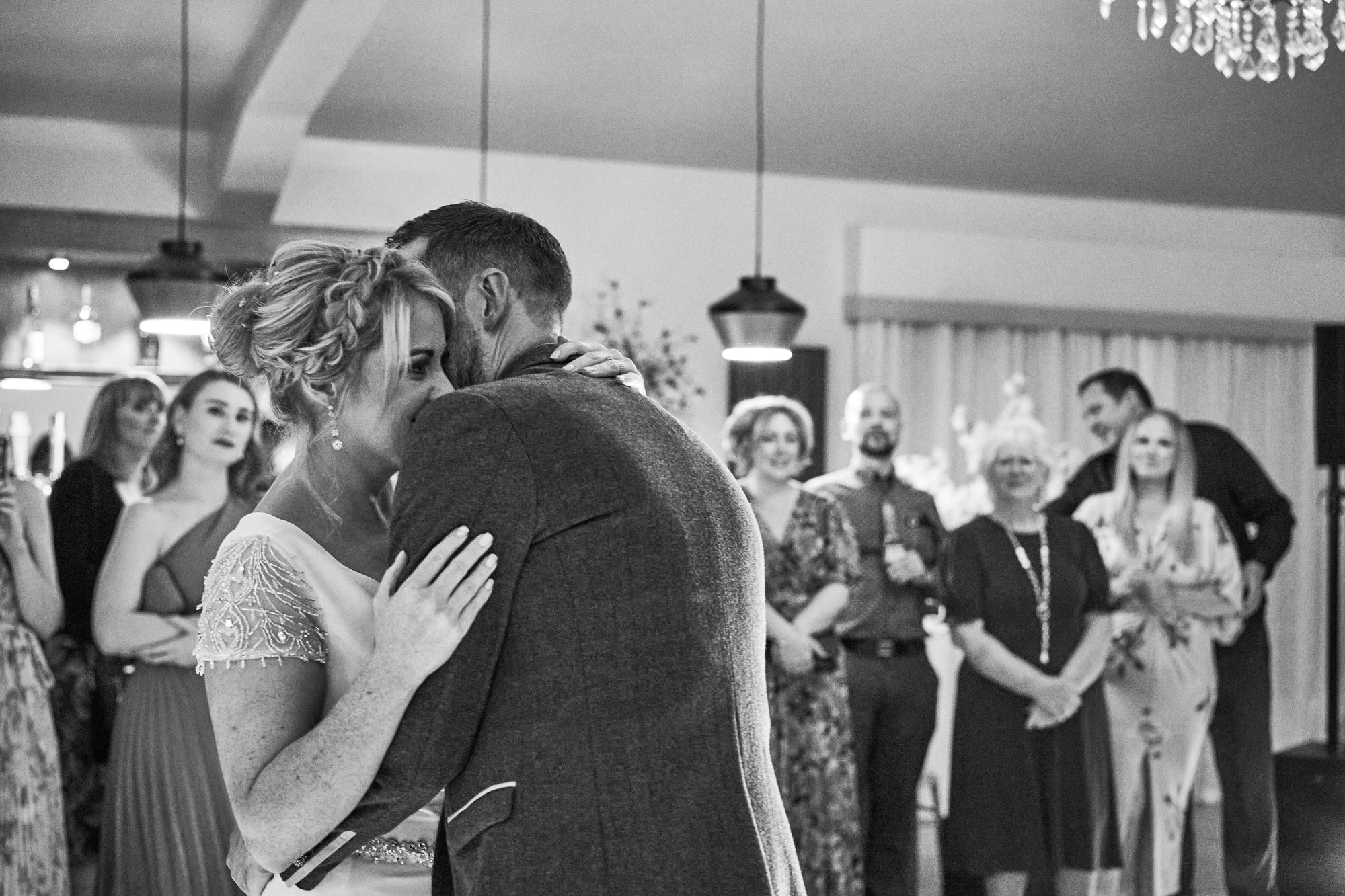 the couple cuddle up for their first dance at The Aviary Ormskirk