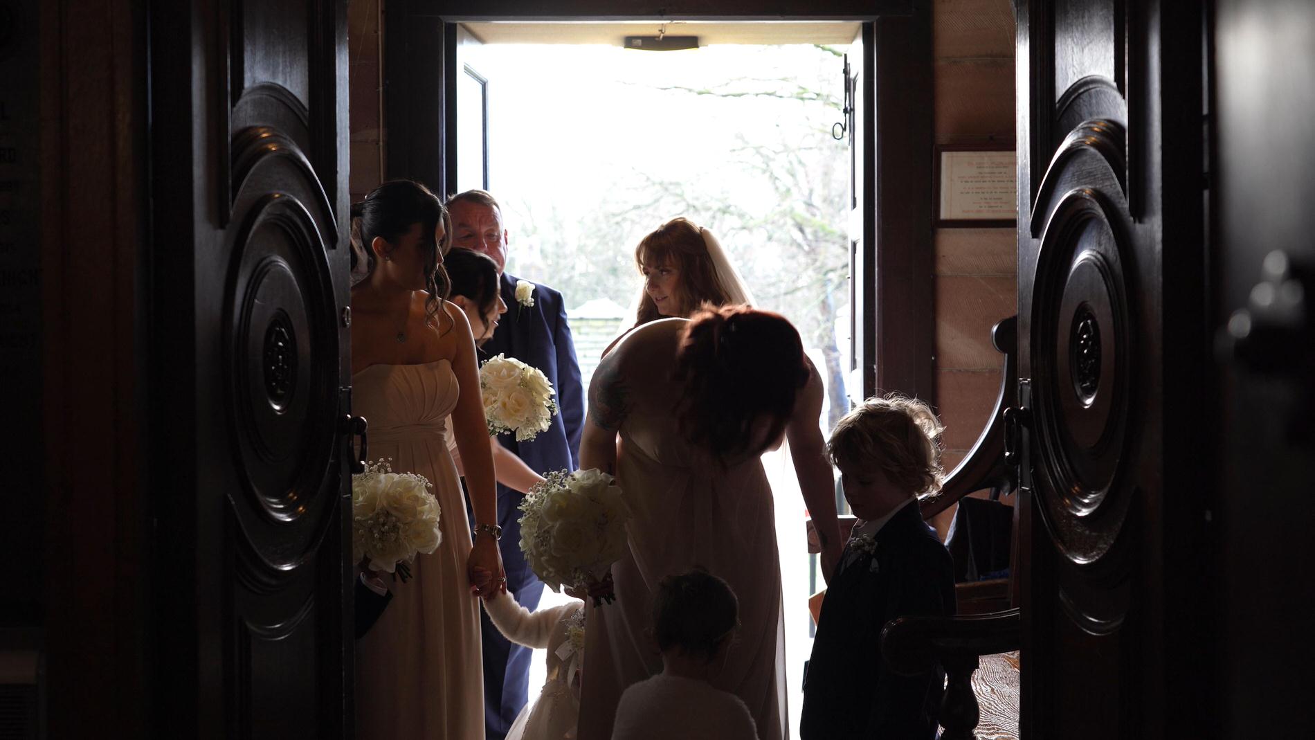 a bride waits to walk down the aisle at St Cuthberts Church in Churchtown