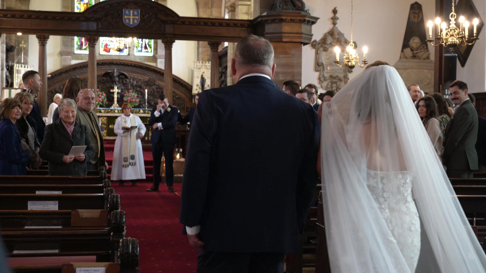a groom gets emotional seeing his bride for the first time