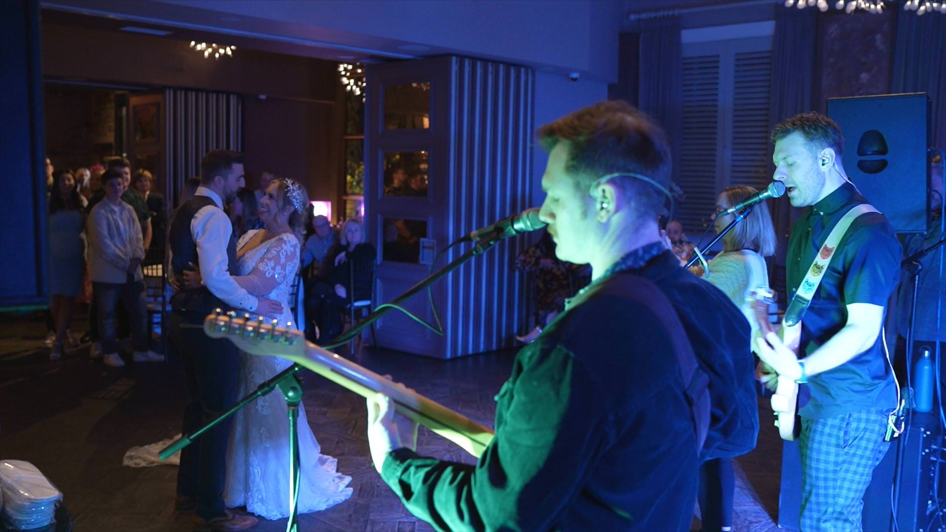 a couple enjoy their first dance at Manor House Lindley with a live band