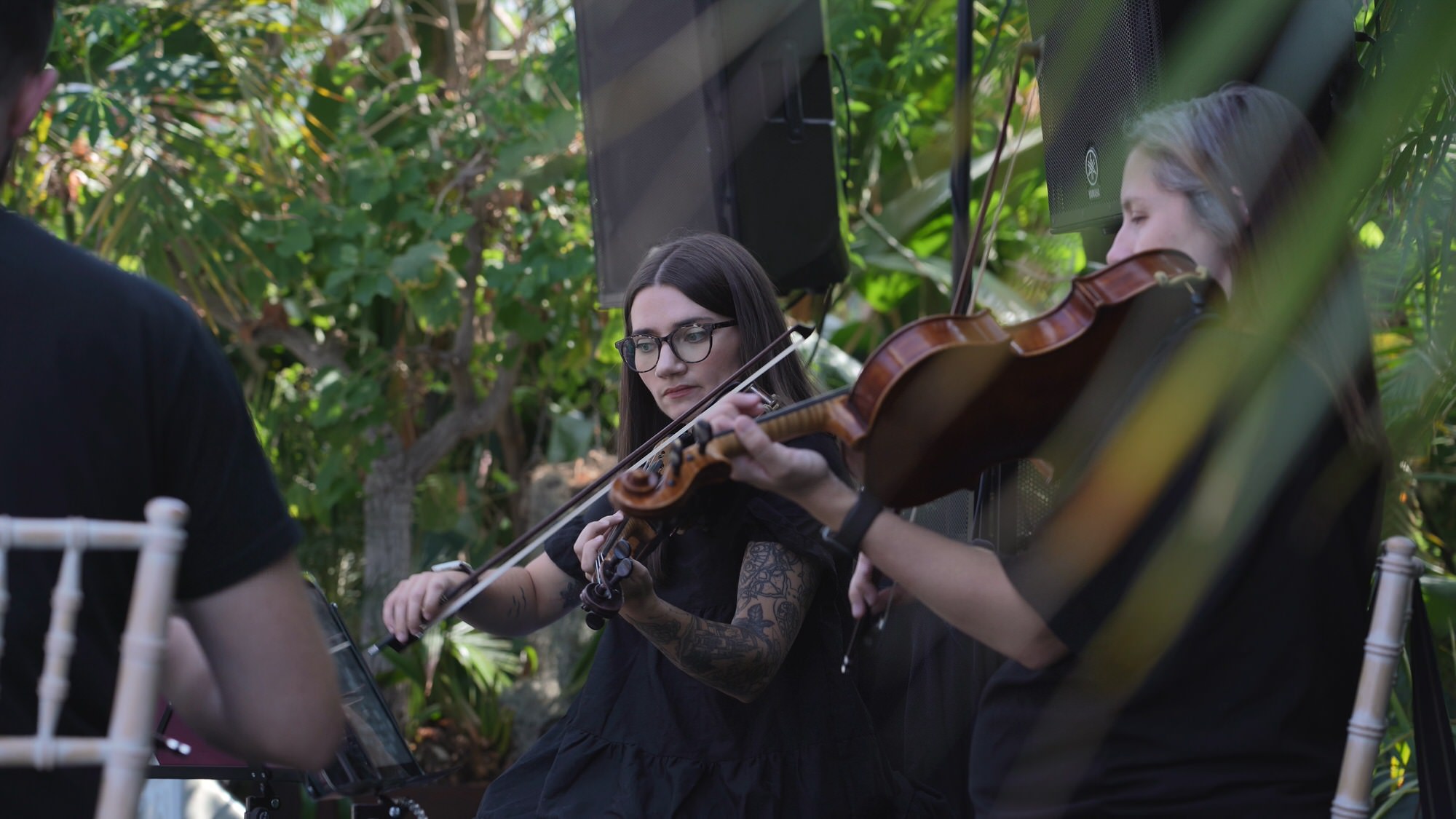 Kirsty and Josh Sefton Palm House Wedding Video 10 a beautiful video still of a string quartet playing for a wedding ceremony at Sefton Park Palm House