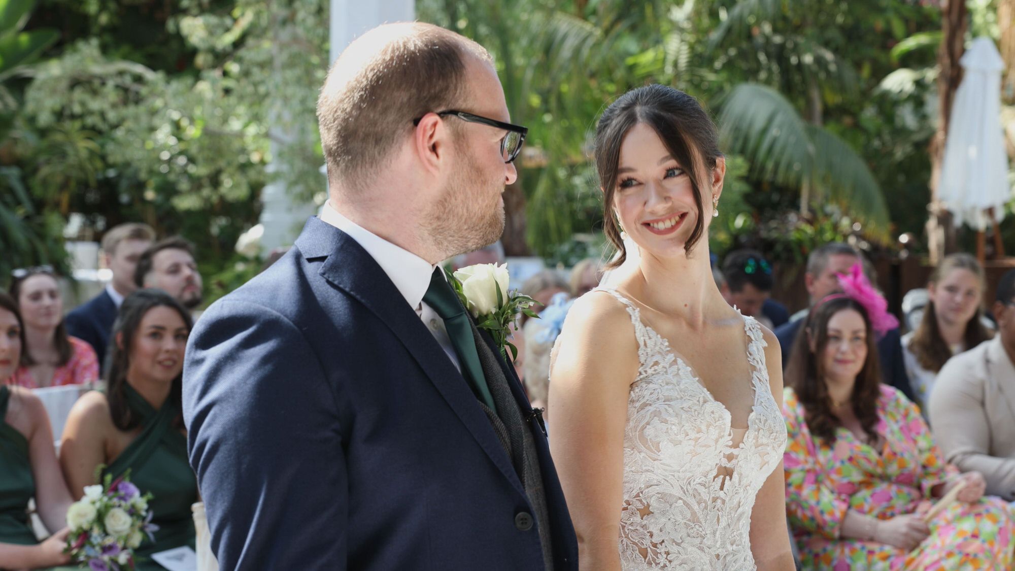 Kirsty and Josh Sefton Palm House Wedding Video 12 videographer captures a natural smile from the couple during a Sefton Park Palm House wedding ceremony