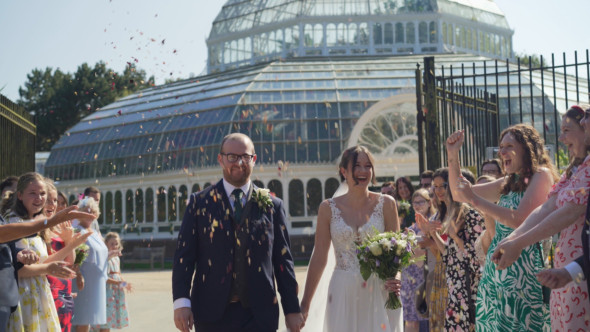 Kirsty and Josh Sefton Palm House Wedding Video 18 a fun confetti video still outside Sefton Park Palm House Liverpool
