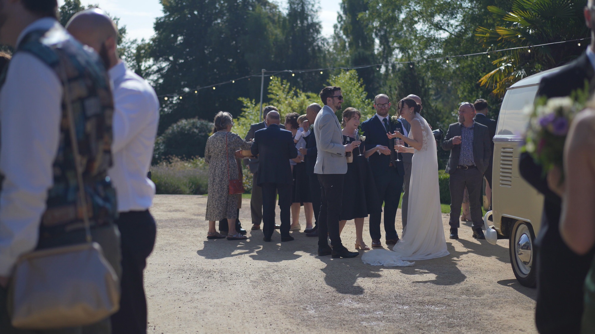 Kirsty and Josh Sefton Palm House Wedding Video 21 a wide shot of guests mingling during reception at Sefton Park Palm House