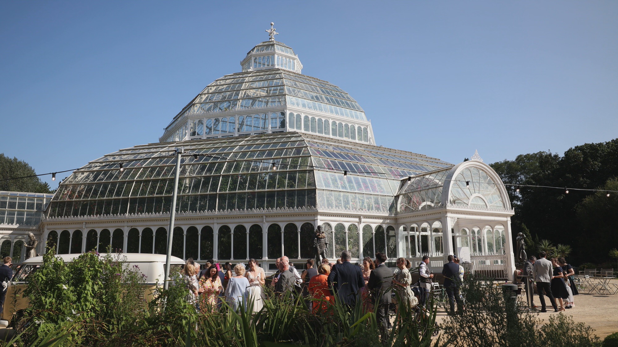 Kirsty and Josh Sefton Palm House Wedding Video 22 a video still of a summer wedding reception outside Sefton Park Palm House Liverpool