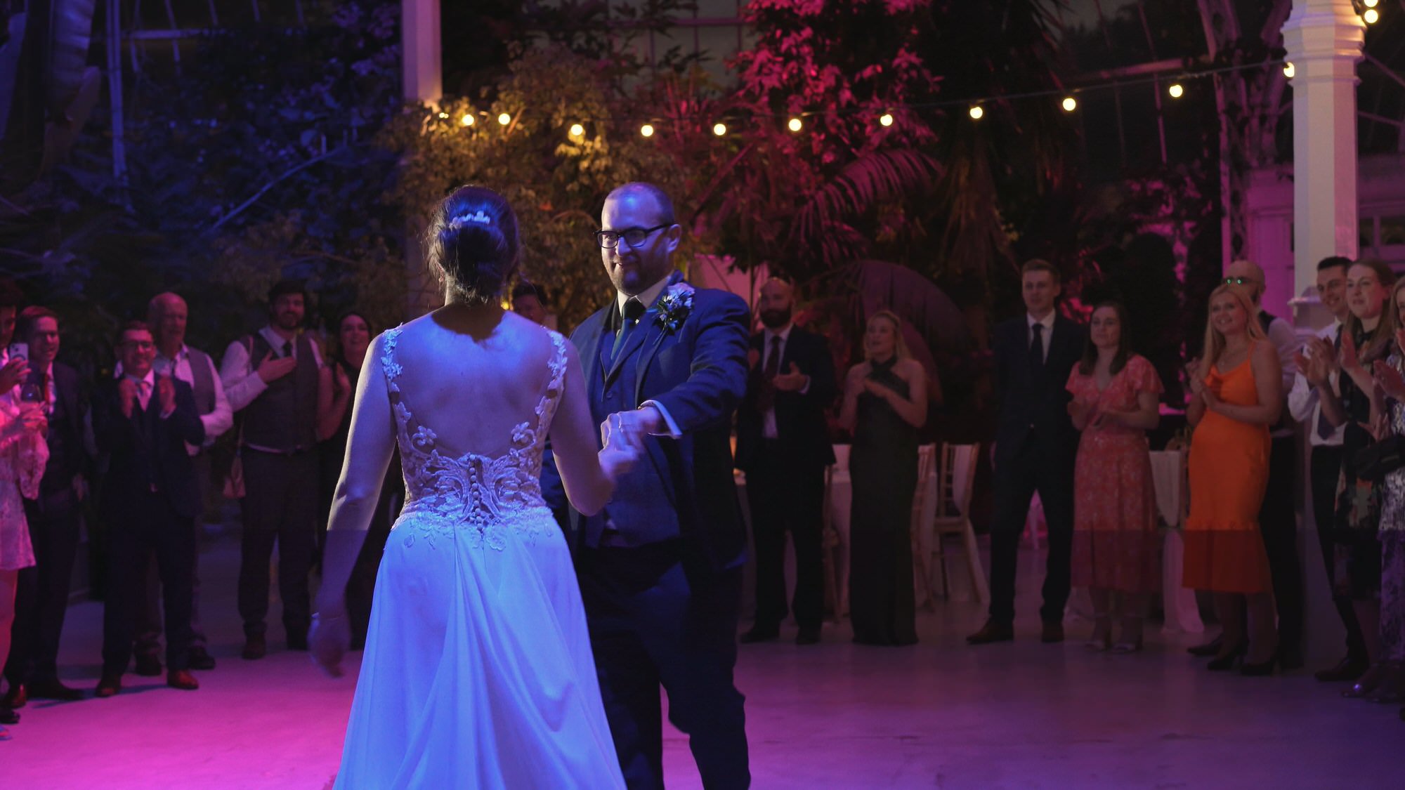 Kirsty and Josh Sefton Palm House Wedding Video 37 a bride and groom surprise guests with a choreographed first dance