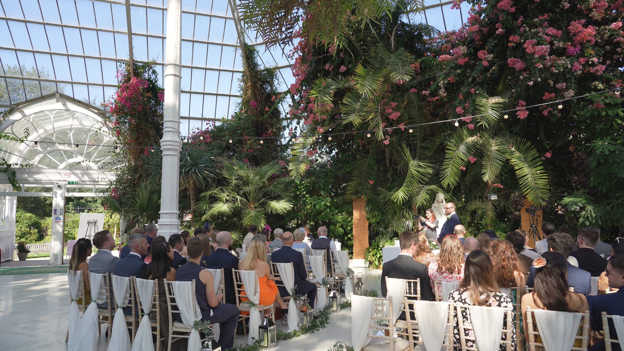 Kirsty and Josh Sefton Palm House Wedding Video 9 a wide video shot of inside Sefton Palm House wedding ceremony