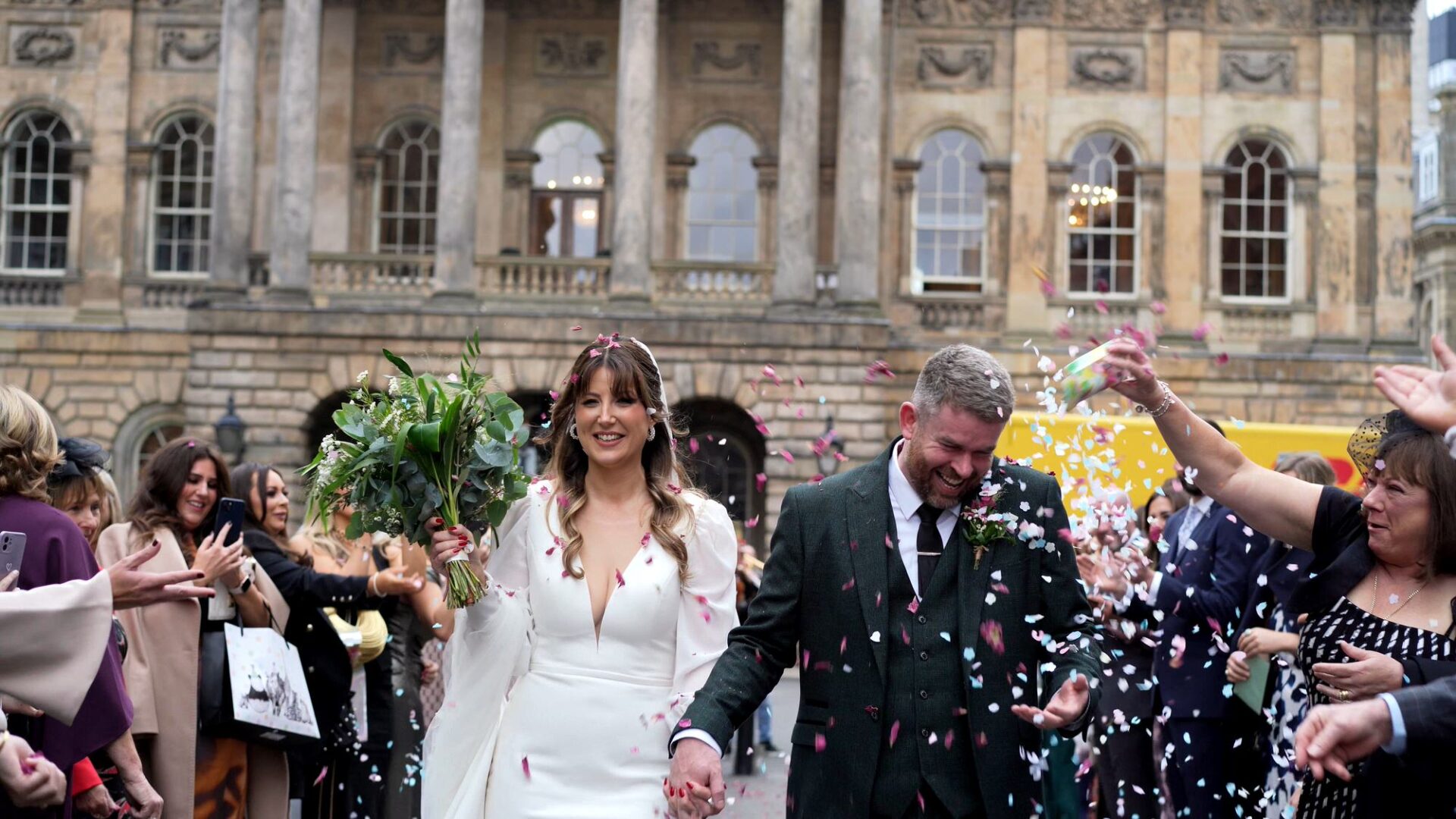 candid wedding videography moment outside Liverpool Town Hall and confetti