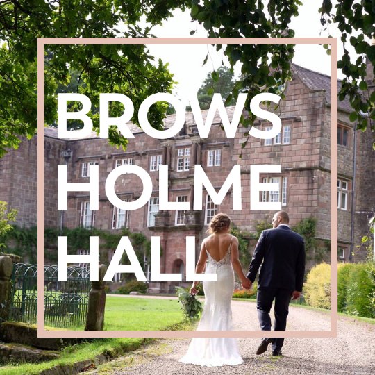 couple walking with videographer outside Browsholme Hall in Lancashire