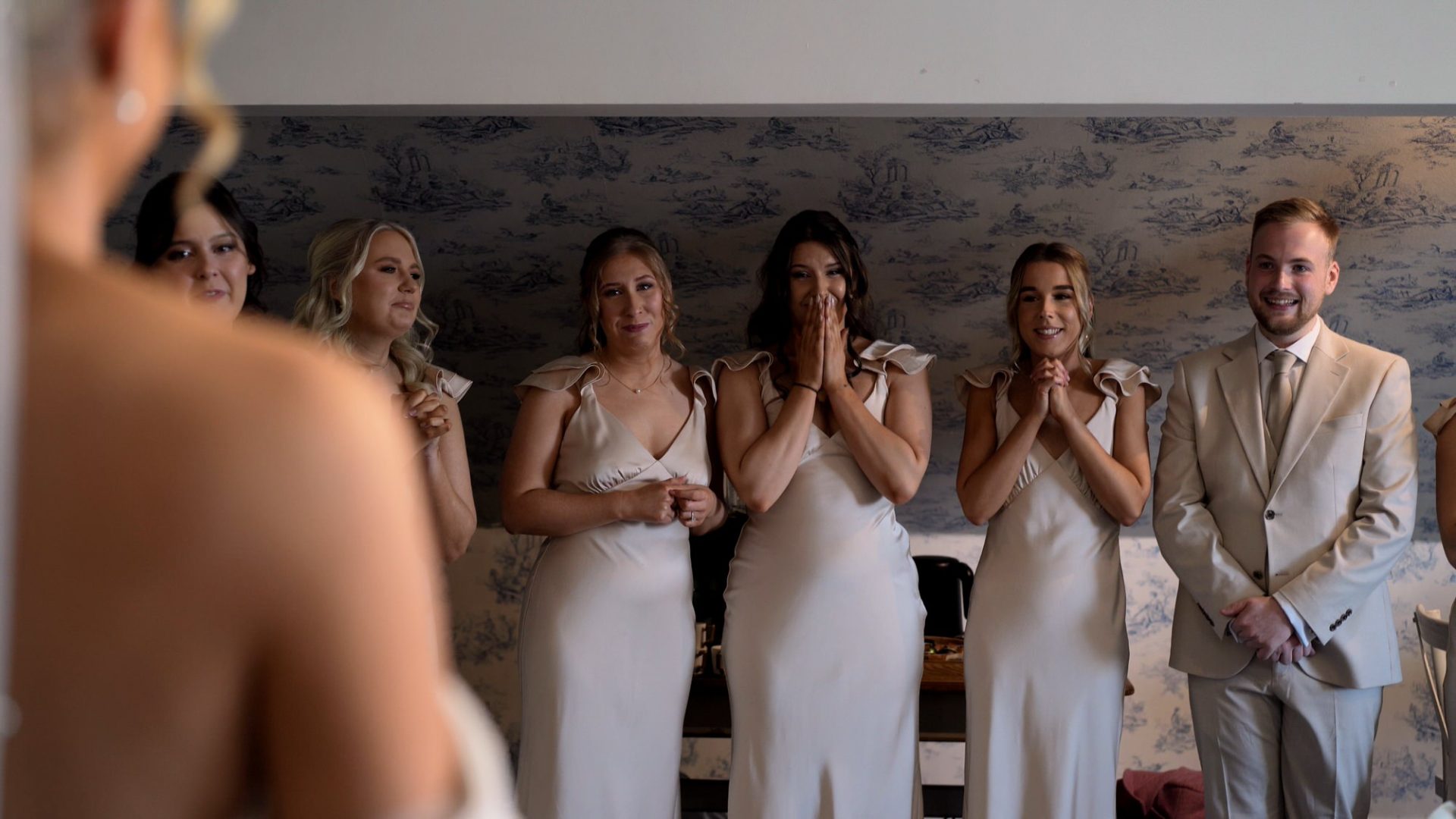 bridesmaids and groomsmaid wipe tears away during first look at Larkspur Lodge in Cheshire