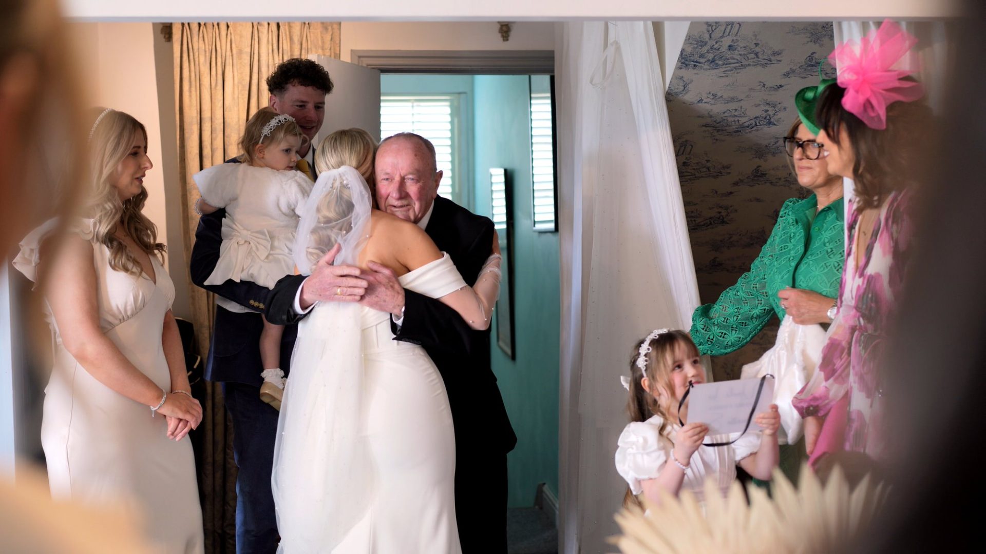 a grandad hugs the bride at Larkspur Lodge in Cheshire