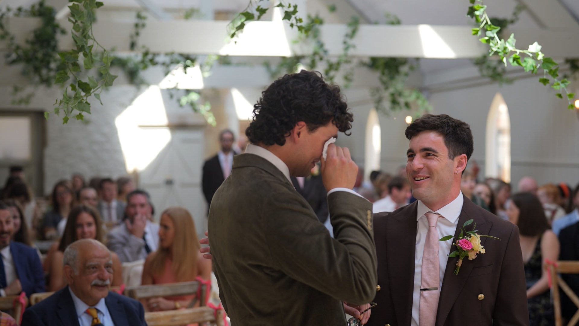 video still of a groom wiping away tears before a ceremony at Wyresdale Park