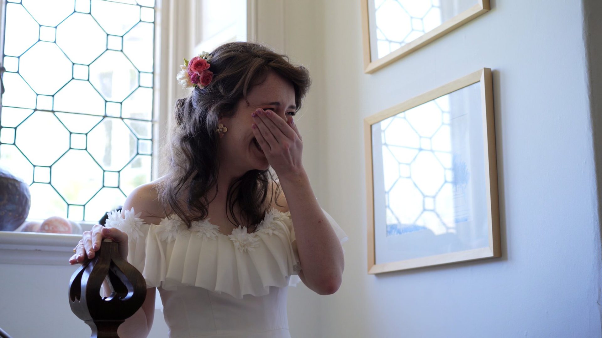 a bride gets emotional seeing her bridesmaids crying
