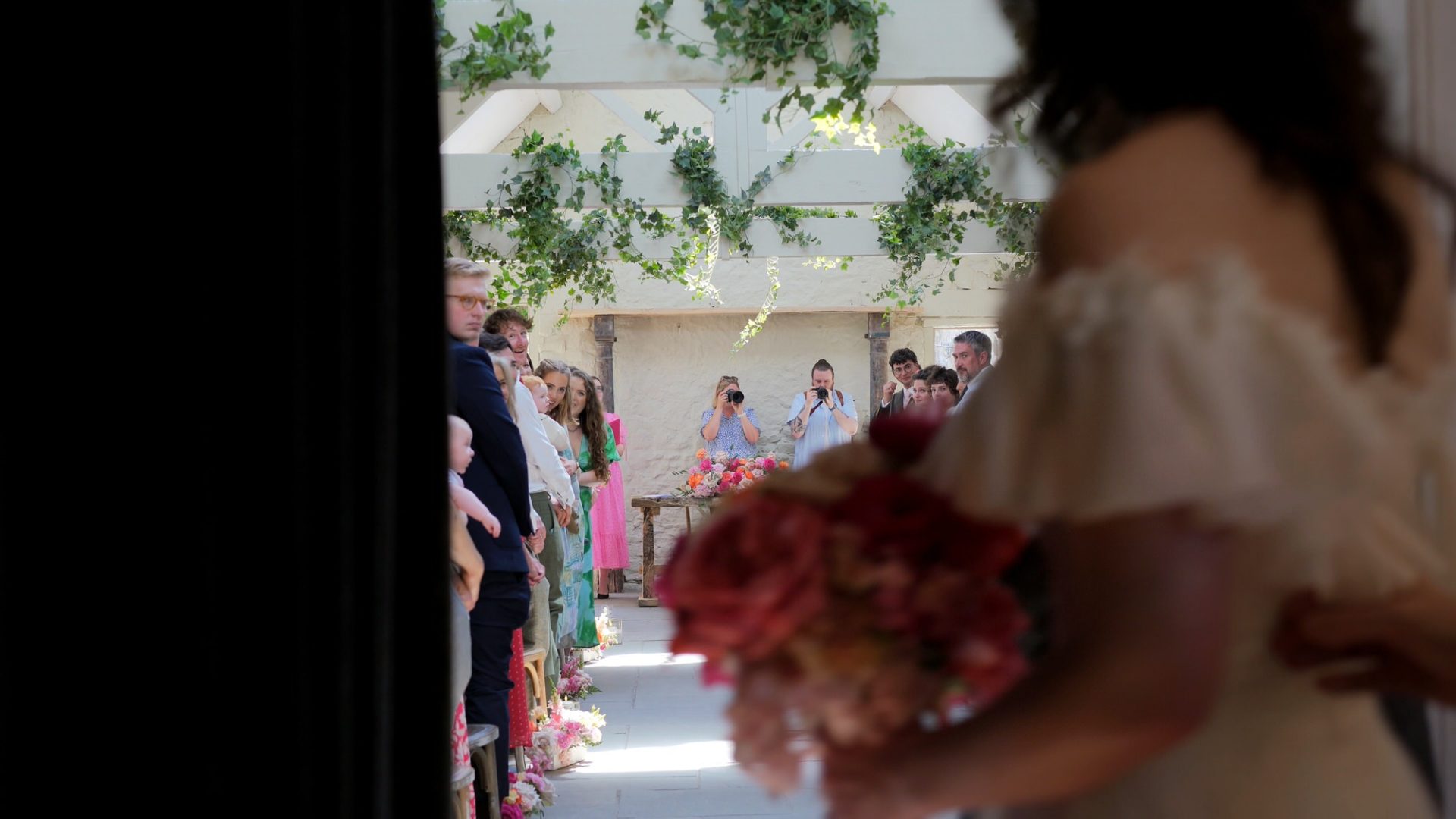 videographer captures the grooms reaction to the bride walking down the aisle at Wyresdale Park