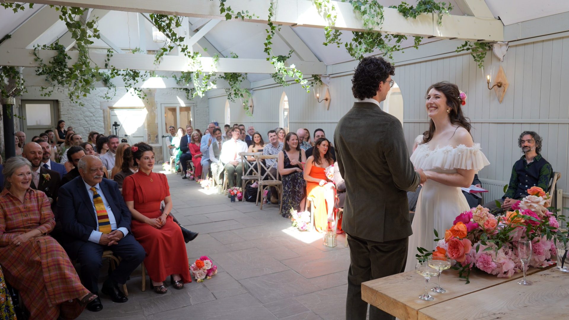 couple smile during wedding ceremony at Wyresdale Park