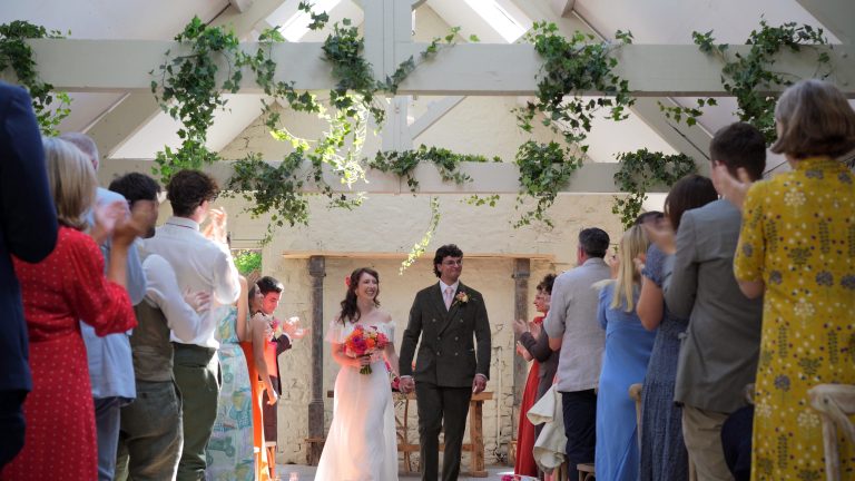 a video still of a bold and colourful vintage inspired wedding ceremony at Wyresdale Park