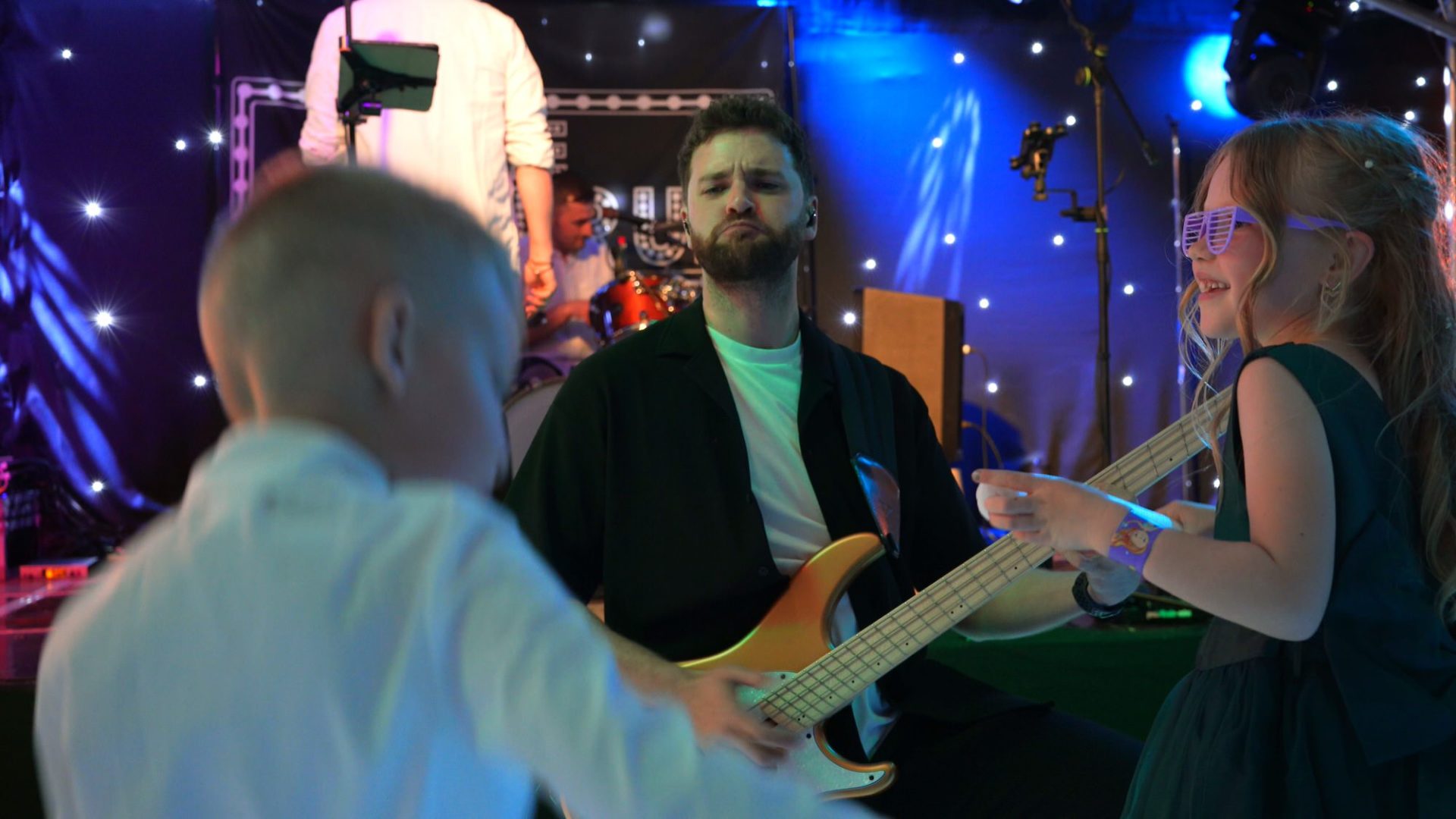 the coverup band interact with kids on the dancefloor