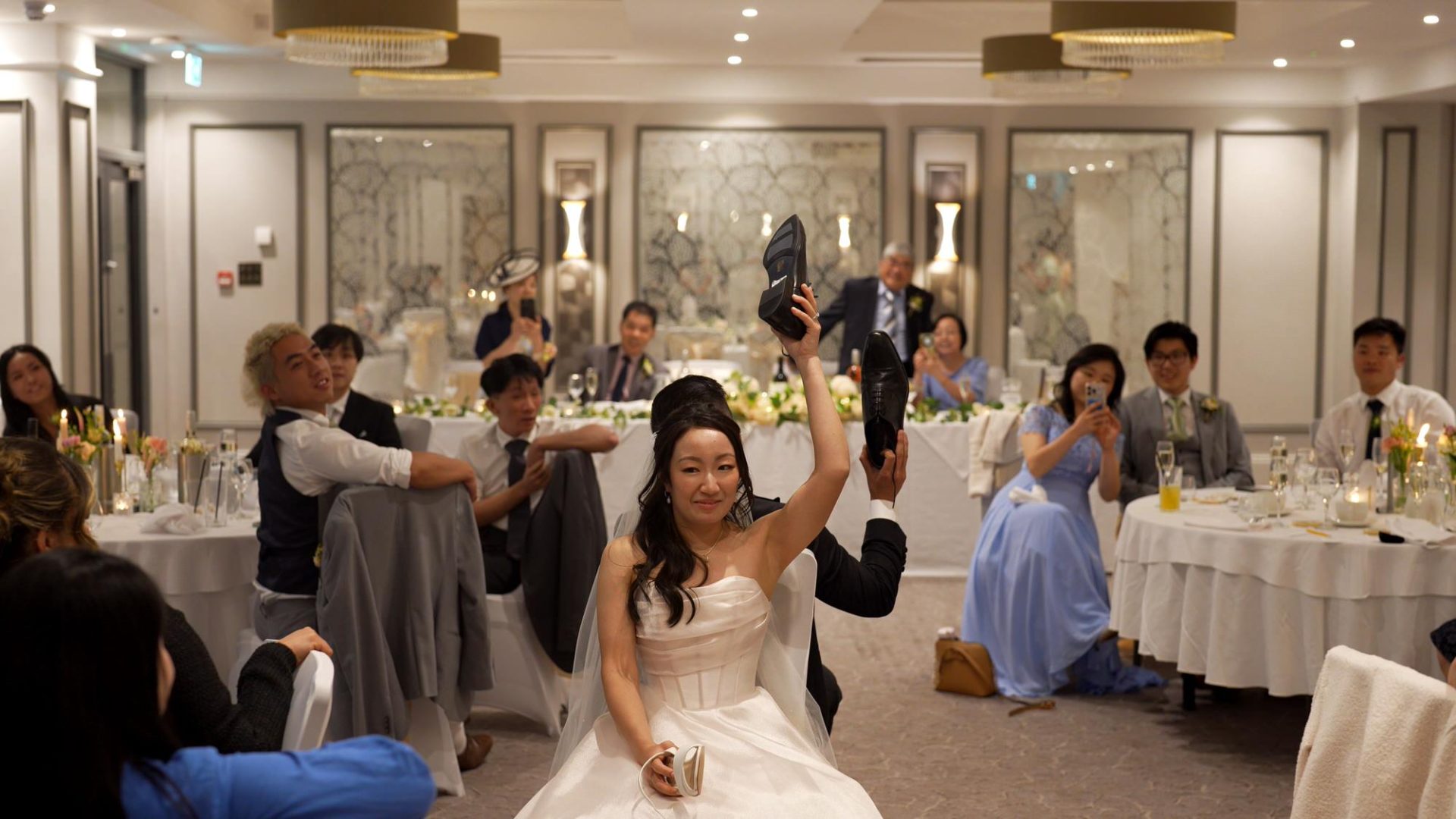 the couple take part in a mr and mrs shoe game at Lodore Falls