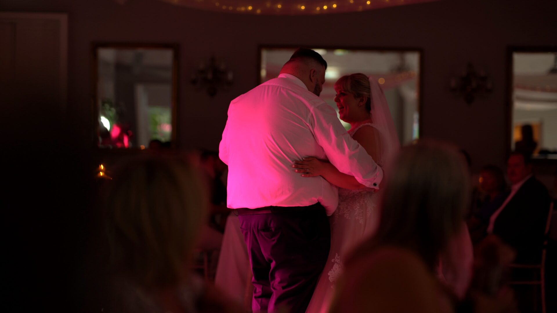 the couples first dance captured from the crowd