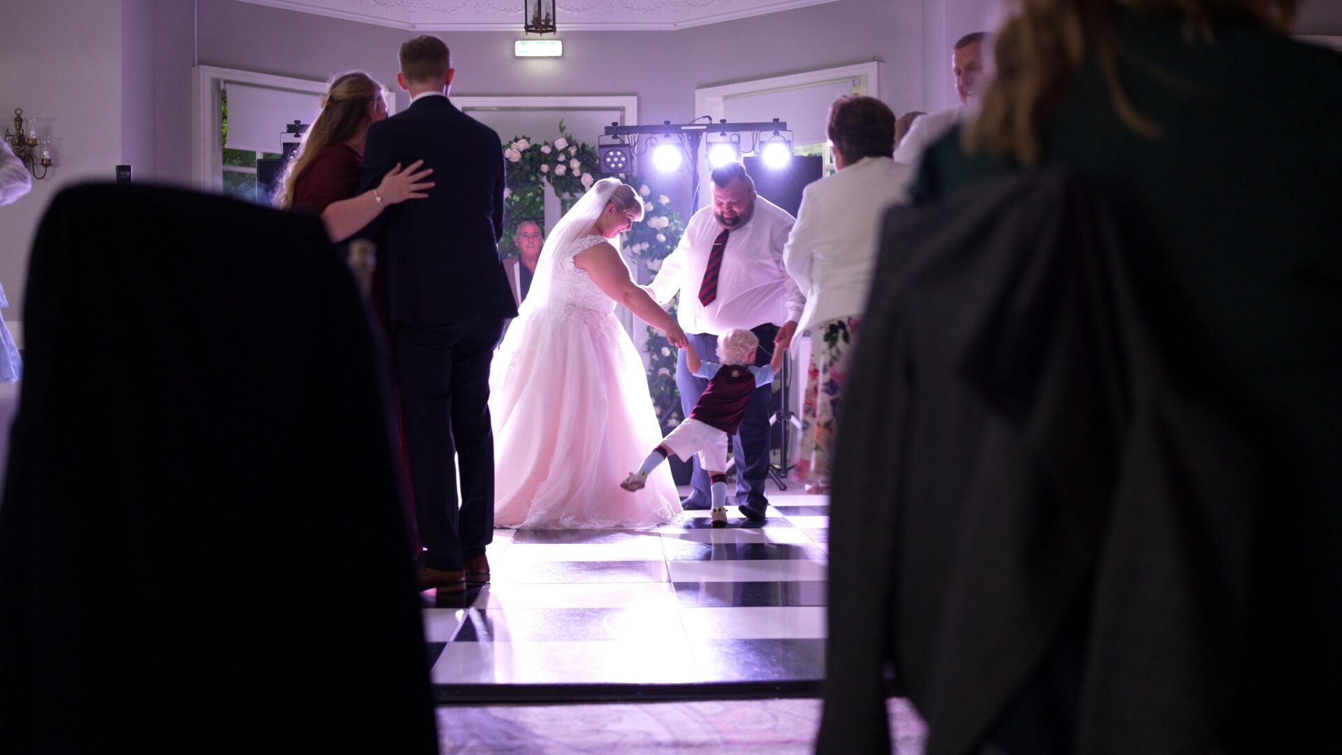 a video still shot through the guests on the dancefloor at Statham Lodge Hotel in Cheshire