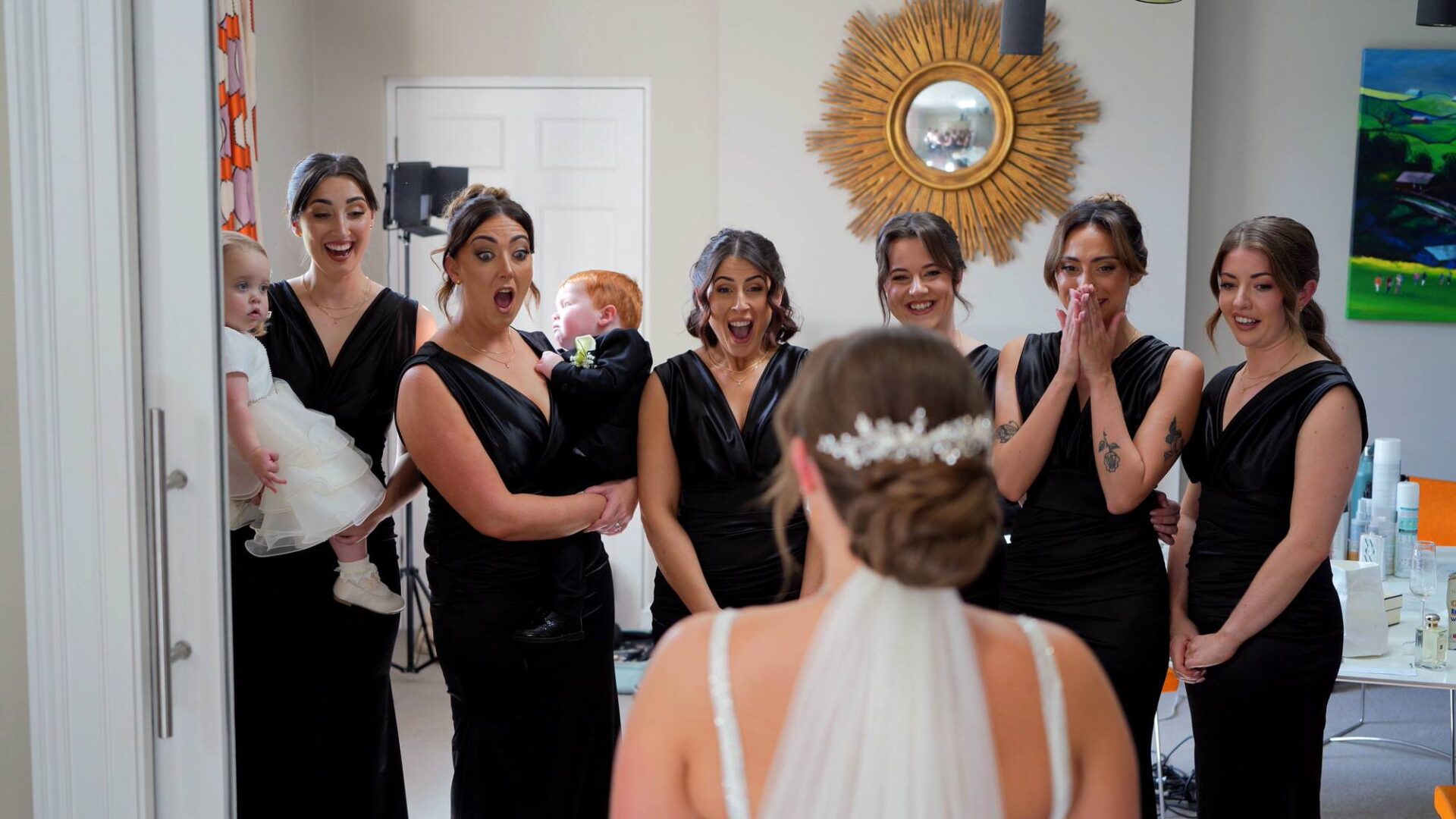 videographer captures bridesmaids reaction to the bride before her ceremony at Rudding Park Harrogate
