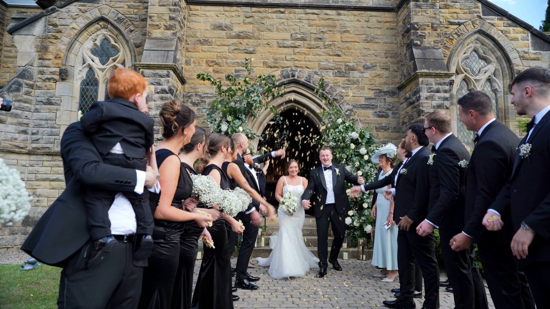 video still of a confetti for a black tie wedding outside Rudding Park Harrogate