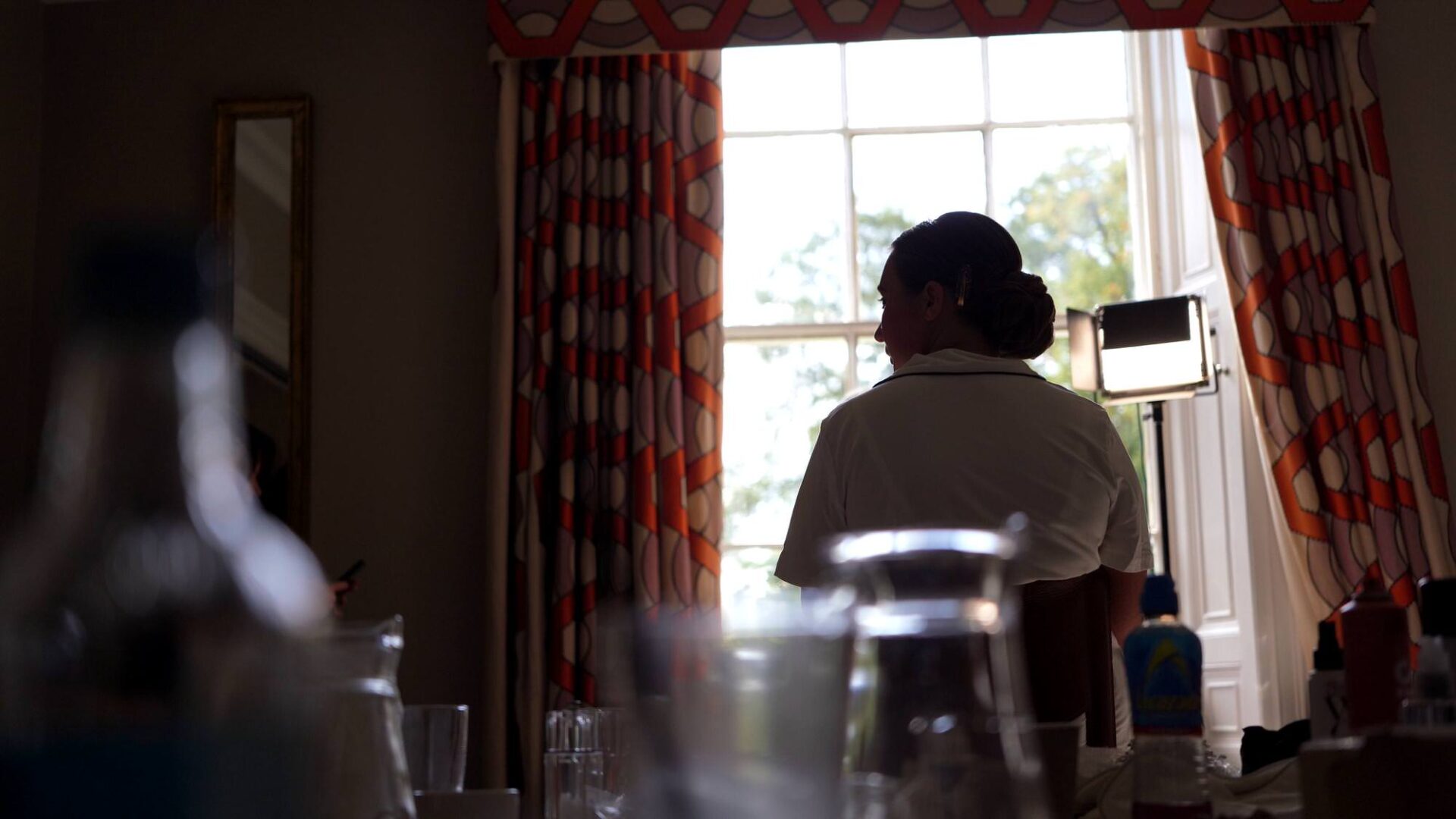 a candid natural light video still of a bride getting make up done at Rudding Park