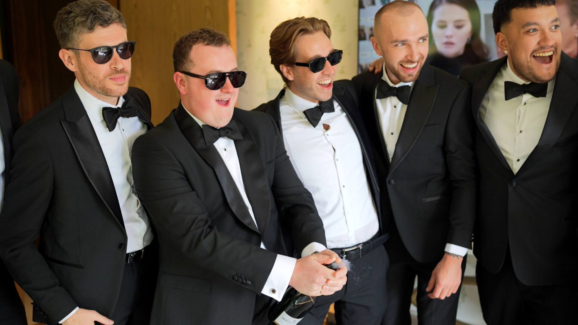 videographer captures a fun shot of the groom with champagne at Rudding Park Harrogate