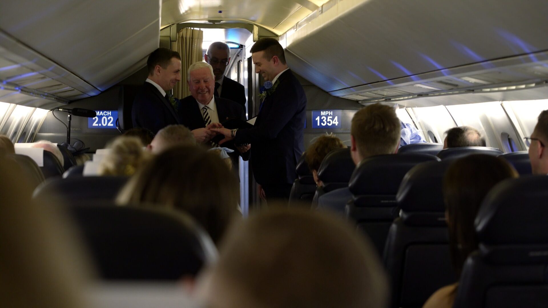 couple exchange wedding rings on boardConcorde Manchester