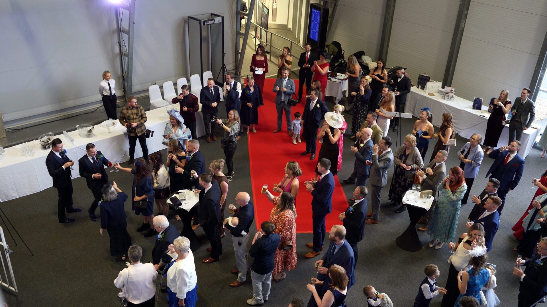 a video shot from concorde steps of guests waiting on the red carpet