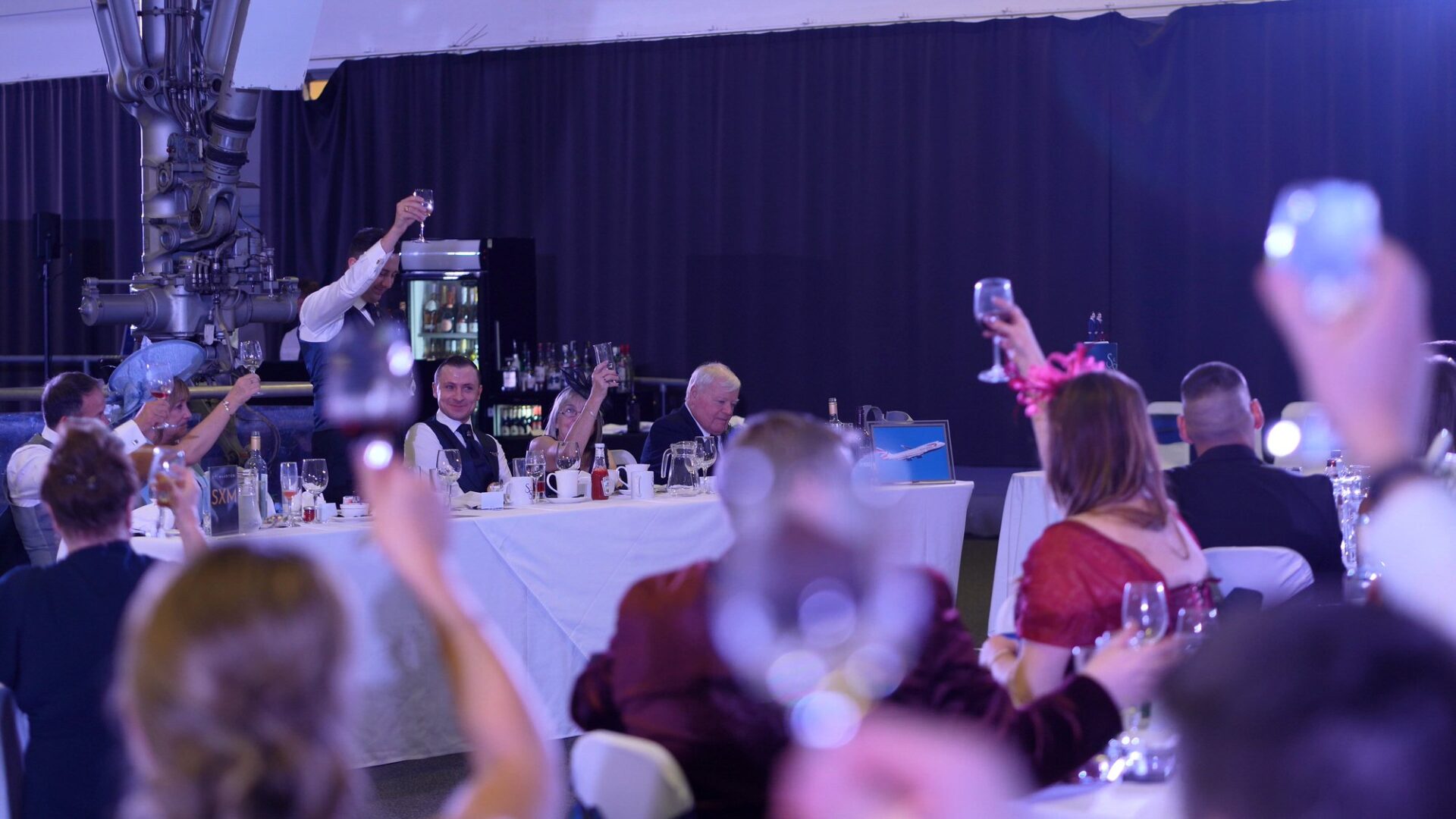 guests raise a toast at the end of the wedding speeches at Concorde Manchester