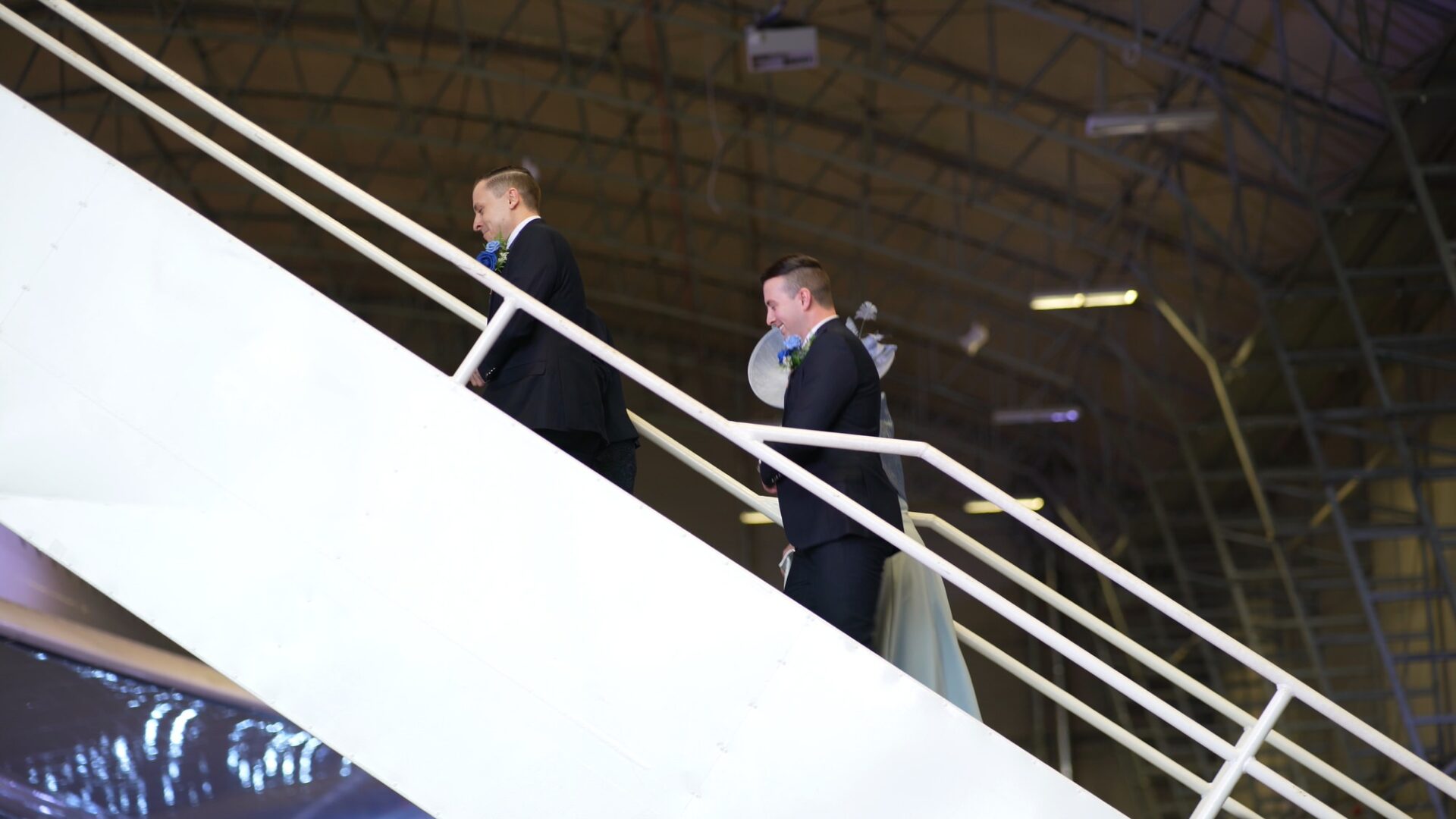 grooms walk up Concordes steps for wedding ceremony